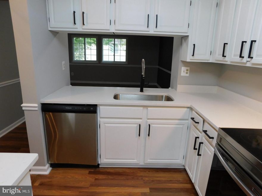 Priced To Sell Fast! Hot Updated 3 Level Townhouse, Spacious Kitchen with QUARTZ Counters, Stainless Steel Appliances, Modern Tile Backsplash, Spacious Bedrooms, New Custom Paint, Updated Bathrooms, New Flooring, New Lighting, Walk Out Basement, Fenced Backyard, Much More!! Close to Schools, Shopping, and Commuter Routes. This Will Not Last!