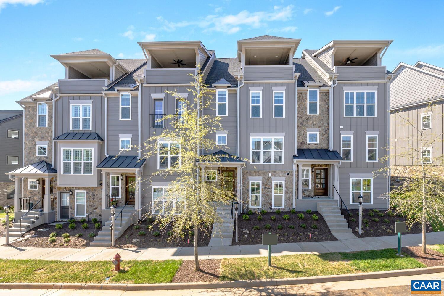 Move-In Ready, End-Unit Townhome with Rooftop Veranda and Blue Ridge Mountain Views! This End Unit Towne includes 4 Finished Floors, Residential Elevator servicing all 4 Floors, Rooftop Veranda and potential rental income with 1st Floor Bedroom/Bath dependency/ADU. This townhome is designed to capture the beautiful Crozet views while incorporating thoughtful, included features and spacious living spaces throughout. Starting with a 2-Car Garage, finished bedroom and full bath dependency/ADU on the lower level, you can head to the open 2nd Level for entertaining in your Kitchen, Great Room with Fireplace, Dining Room & spacious Trex Screened-In Deck (plus a half bath!). The 3rd Level is home to the private Owner's Suite & Bath, second bedroom, full bath and Laundry Room. The 4th Level comes with a finished Rec Room, full bath, Private Study & show-stopping Veranda. Located in amenity-filled Old Trail, you can enjoy all that this neighborhood & Crozet have to offer! This Townhome is ready for March 2025 Move-In!,Granite Counter,Fireplace in Great Room