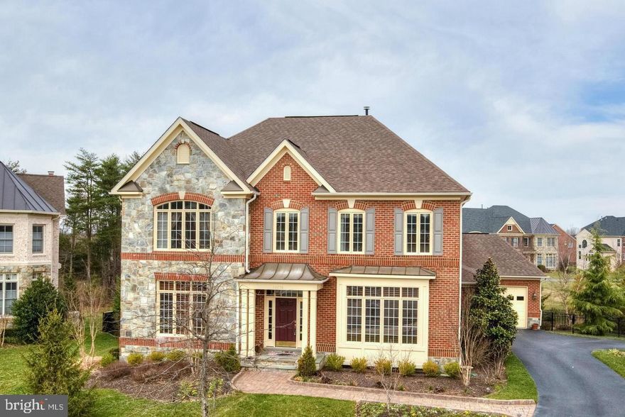 Welcome to POPLAR Parc – A Premier Community in Chantilly! Nestled on a quiet cul-de-sac in one of Chantilly’s most sought-after neighborhoods, this meticulously maintained brick and stone Colonial offers luxury living at its finest. Set on a beautifully landscaped lot, this stunning WCI Renaissance Grand Cezanne model boasts approximately 7,300 square feet of finished living space across three levels. Featuring a four-sided brick exterior with a stately stone and brick front and an oversized 3-car side-load garage, this home is as elegant as it is functional. With six bedrooms, six full bathrooms, and two half baths, it’s freshly painted and truly move-in ready—perfectly situated on a prime lot with lots of privacy. 
Step inside to a dramatic two-story foyer with a sweeping curved staircase adorned with wrought iron railings, leading to rich American walnut hardwood floors throughout the main level. Elegant crown molding, recessed lighting, and 10’ ceilings add to the grandeur.
The main level offers spacious formal living and dining rooms, a private office with custom built-ins, and an expansive family room with a coffered ceiling and cozy fireplace. The morning room, bathed in natural light, opens to a screened-in porch and Trex deck, overlooking a private, tree-lined backyard—ideal for relaxing or entertaining.
At the heart of the home, the gourmet kitchen is a chef’s dream, featuring 42” raised-panel Decora cabinetry, an oversized island with gas cooktop, granite countertops and backsplash, stainless steel appliances, a wall oven, and a butler’s pantry complete with an under-counter beverage cooler. Built-in water boiling system for morning coffee and tea. 
Upstairs, the luxurious owner’s suite offers a double door entry, tray ceiling, his and hers walk-in closets, a private sitting or fitness area, and a spa-inspired bathroom with dual vanities, granite counters, a soaking tub, and separate shower. Three additional generously sized bedrooms, each with its own ensuite bath and walk-in closet, plus a convenient upper-level laundry room, complete this level.
The fully finished walk-out basement includes new wood flooring, a media/theater room, wet bar, recreation room, guest bedroom, full bath, and an additional flexible-use room—perfect for hobbies or a home gym.
Recent updates include:  New water heater (2023), HVAC system for the main level and basement(2022),  Dishwasher and disposal (2023).  Washer and dryer (2023), New sump pump (2025), Deck Screen (2025)
POPLAR Parc offers convenient access to U.S. Route 50, I-66, Route 28, and Fairfax County Parkway. You’re just minutes from The Field at Commonwealth, Fair Lakes Shopping Center, Fair Oaks Mall, Fairfax Corner, Chantilly Library, and Fair Oaks Hospital. Dulles International Airport and George Mason University are within a 15-minute drive. Outdoor enthusiasts will enjoy nearby Ellanor C. Lawrence Park, which features hiking trails, fishing, sports fields, picnic areas, and an amphitheater.
Located in the highly regarded Chantilly High School district: Poplar Tree(ES), Rocky Run(MS), Chantilly(HS).