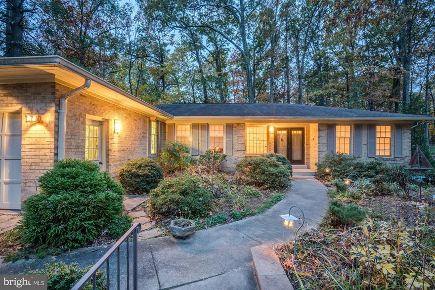 Woodson pyramid, minutes to GMU, 3.5 miles to Beltway. Upgraded kitchen with soft-close millwork, turntable storage, pull-out accessories, gas cooktop w/ restaurant style stainless hood, & impressive stone counter. High ceilings in family room, hardwood floors, upgraded recessed lighting everywhere. Recent Carrier gas heating & hot water. Private garden patio, mature shade trees & exotic plantings