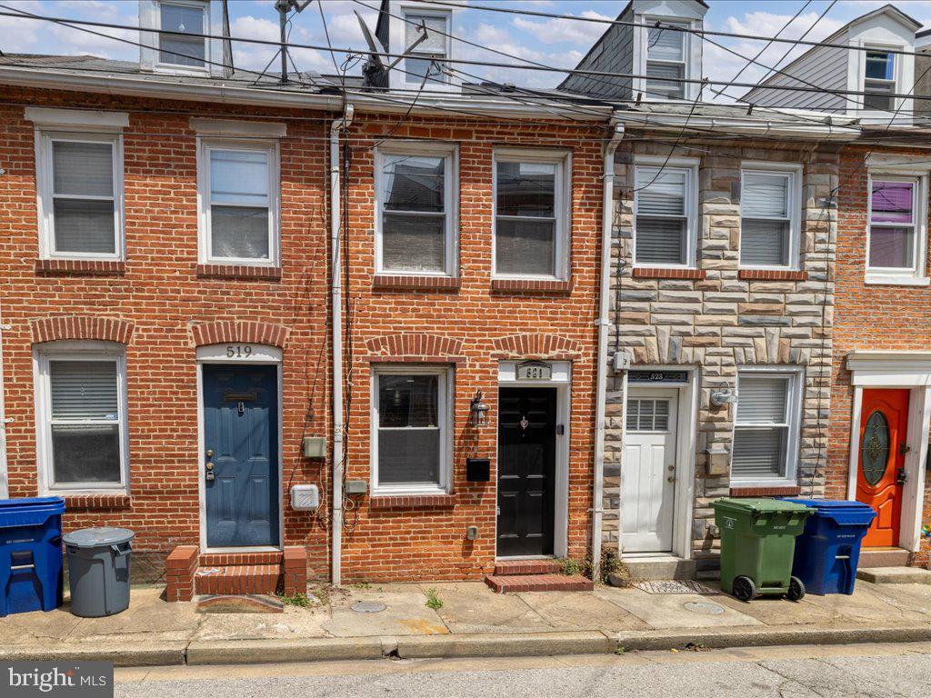 This home puts the Charm in Charm City. Welcome to 521 S Chapel St, located in the prestigious and highly sought after Upper Fells point neighborhood of Baltimore. Live the ultimate urban lifestyle in this recently renovated 2 story row home. Nestled on a quiet one way street, this home features 2 beds, 1.5 baths, the classic Baltimore - esque exposed brick, new waterproof luxury vinyl plank flooring throughout. recessed LED lighting, central air, galley kitchen with granite counters and stainless steel appliances as well as access to your very own private outdoor patio. Outside your door, explore the eclectic charm of Fells Point, with its cobblestone streets, boutique shops, and award-winning restaurants just steps away. Take a stroll along the waterfront promenade, or hop on a water taxi to explore nearby attractions such as the Harbor East Development and the Inner Harbor. For those craving outdoor adventure, Patterson Park and Canton Waterfront Park offer endless opportunities for recreation and relaxation. Close to Johns Hopkins Hospital and ideal for hospital workers working late shifts which also makes this property an excellent investment property. Easy access to major highways and public transportation. Don't miss your chance to own a piece of history in one of Baltimore's most coveted neighborhoods. Available furnished or un furnished. Schedule your tour today!
