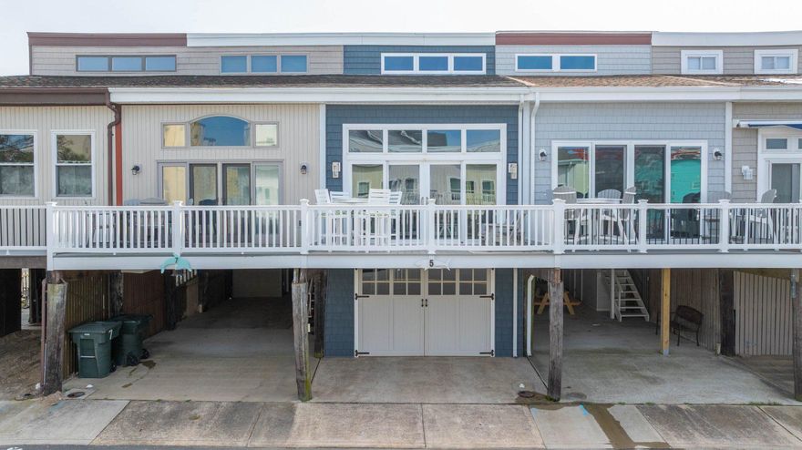 Ocean City living with no HOA or condo fees! This beautifully updated multi-level home at 5 129th Street offers the perfect blend of modern comfort and coastal lifestyle, just steps from the beach and some of North Ocean City’s most desirable attractions. Thoughtfully designed, the home features a full bedroom and bathroom on the main level—ideal for guests or flexible living—along with an expanded kitchen showcasing granite countertops, stainless steel appliances, and recessed lighting for a bright, contemporary feel. Upstairs, the third floor includes two additional bedrooms connected by a Jack and Jill bathroom with a tiled shower, offering both functionality and privacy. One bedroom features soft carpeting, while both spaces are filled with abundant natural light, creating a warm and inviting atmosphere. Outdoor living is a highlight, with low-maintenance Trex decking off the second floor—perfect for relaxing after a day at the beach—as well as a convenient outdoor shower for rinsing off sand and saltwater. Additional features include a garage, an in-home washer and dryer, and a furnace and HVAC system that are less than eight years old, providing added efficiency and peace of mind. Located in North Ocean City, this property places you close to some of the area’s most popular destinations. Spend your days enjoying the wide, free beaches that stretch for miles along the coast or take a short walk to Northside Park, a 58-acre waterfront park featuring walking trails, fishing piers, playgrounds, and year-round events. For classic Ocean City experiences, the iconic Ocean City boardwalk offers dining, shopping and entertainment. Whether you’re looking for a full-time residence or vacation getaway, this home offers an ideal location and layout to enjoy everything this premier coastal destination has to offer.
