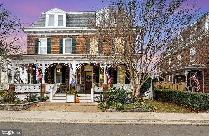 Welcome to the beautifully restored Dr. R.H. Smith House—a distinguished historic duplex honored with the City of Havre de Grace Historical Preservation Award (2022) and featured on the 2023 Lock House Candlelight Tour. Ideally situated within walking distance to the charming shops, cafés, and waterfront restaurants of historic downtown Havre de Grace, this home perfectly blends modern comfort with enduring character. Step onto the expansive front porch and into a warm interior showcasing refinished hardwood floors, original mantles, and intricate historic moldings. The updated kitchen offers modern functionality while respecting the home’s architectural roots, and the adjacent mudroom provides practical convenience for everyday living. The home features three spacious bedrooms on the second floor and two additional bedrooms on the third floor, offering flexibility for guests, offices, or creative space. Out back, enjoy a custom patio and fully fenced yard, ideal for entertaining, gardening, or relaxing in your own private retreat. With its rare combination of history, craftsmanship, and thoughtful upgrades—all in an unbeatable location—this remarkable property invites you to experience the true charm of Havre de Grace.