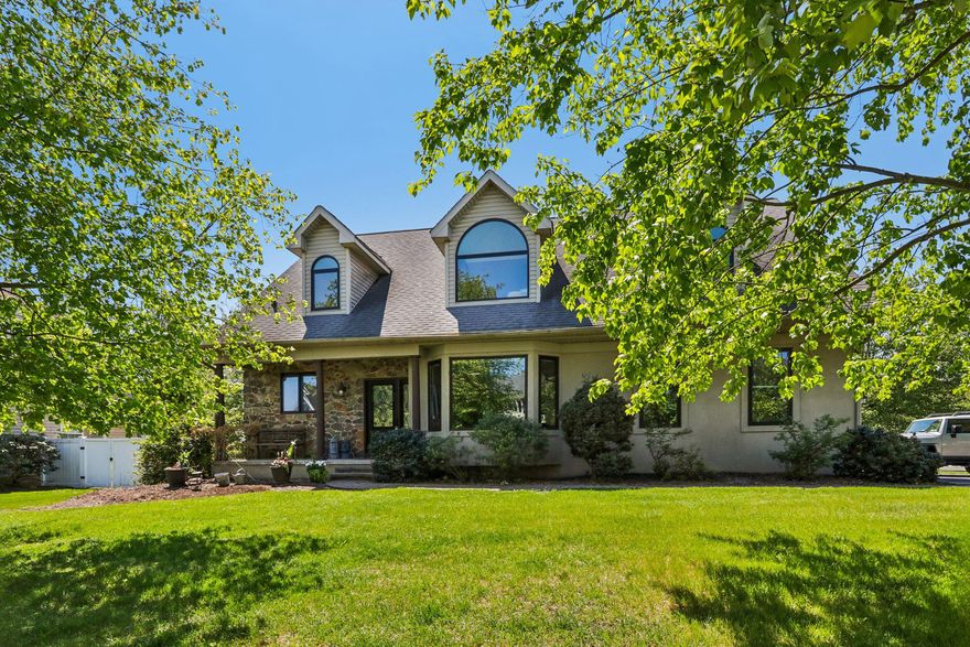 Welcome to 837 Mountaintop Drive! Nestled in the charming community of Skippack Ridge, this corner-lot, 4-bedroom, 2-full and 2-half bath home offers a perfect blend of comfort and style, ready for you to make it your own. 
Step inside to discover an open floor plan that seamlessly connects the living and dining areas, enhanced by the natural light from multiple bay windows. The spacious family room, complete with a fireplace and two story ceilings, is perfect for entertaining and gathering. The well-appointed kitchen includes a granite countertops and a double sink, set beneath a window with a view of the front yard. Beyond the family room lies a large outdoor deck, which overlooks the fenced backyard. Also on the main level is the primary suite, featuring a luxurious walk-in closet and an en-suite bathroom with a double vanity and a newly tiled shower (2022). The first floor also has a half bath and access to the two-car garage. 
Once upstairs, you’ll find a bright and comfortable reading nook that connects the bright and three generously sized bedrooms, each with their own walk-in closets. The hallway bathroom features another double vanity and a full-sized shower tub. 
The basement offers a range of possibilities with several separate spaces: a large kitchenette with a mini fridge and sink plus a bedroom with built-ins offers a wonderful opportunity for a in-law or guest suite. There is a half bath and a laundry room, plus a space for exercising. Additionally, there is a wide open space that would be perfect for a game room, playroom, or music room - the options are endless! Two storage areas complete the basement.
The home is set on a quarter acre with easy access to the neighborhood walking trail. Located in the desirable Perkiomen Valley School District and just ten minutes to either Skippack or Collegeville Borough, this home is one you won’t want to miss!