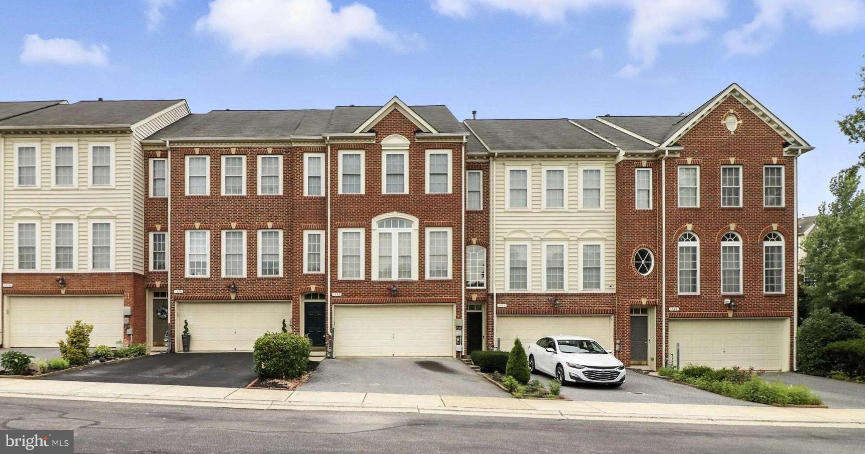 Spacious three level brick-front townhouse with 3 bedrooms 3 full and one half bath. Open-floor-plan boasts an extra large gourmet kitchen with stainless steel appliances and granite countertop, double oven with separate gas cooktop. Large deck with excellent views extends the entertainment options even further. Beautiful primary bedroom suite with walk-in closet and luxury bath. Family room with gas fireplace. Two car garage in addition to the driveway provides abundant parking and storage. Convenient to lots of shopping, recreation and restaurants. Ready to move in immediately.