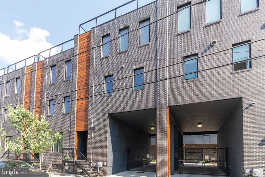 Moyer Court is a sought after development in the best location in Fishtown, which was ranked the #1 neighborhood in America by Forbes Magazine. Unit #3 is the Carriage House that is over 22 feet wide. This home spared no expense with upgrades from the high end GE Cafe kitchen appliance suite, to the gorgeous backsplash tiles that extend all the way to the ceiling, and huge custom walk-in pantry off the kitchen. Enter this gated community and park in your one car garage, where you'll be greeted by a foyer with multiple large closets for extra storage. Up a level, you will find your jaw dropping main living level. This floor is complete with large living room and separate dining area, convenient powder room, beautiful oak hardwood floors, and an absolutely gorgeous kitchen with tons of cabinets and large island. Up another level, you will find all three bedrooms conveniently on the same floor. The master suite is complete with gorgeous spa-like bathroom and custom walk in closet. Two well appointed bedrooms with good closet space are on this level along with a beautiful full bathroom and laundry. Up one more level you will find the incredible roof deck with 360 degree views of all the beautiful City of Philadelphia has to offer. Partial Green Roof allows for some beautiful greenery and the upgraded pergola can provide some shade to truly enjoy this gorgeous deck. This spectacular home is less than a 10 minute walk from everything Fishtown has to offer such as Suraya, WM Mulherin's, Pizzaria Beddia, LaColombe as well as Penn Treaty Park, and Palmer Park. Located in the highly rated Adaire catchment, and on the same block as the brand new Fishtown splash ground. With 7 years left on the tax abatement this home has everything and will not last long!