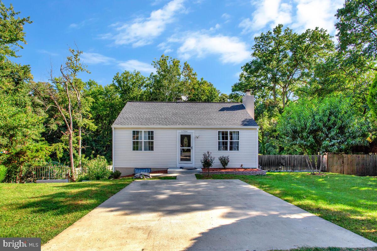 Immaculately Maintained Rambler Backing to Mature Trees is ready for it's new owner! Welcome home to this beautifully maintained rambler nestled on a serene lot backing to mature trees. Freshly painted and filled with natural light, the main level boasts gleaming hardwood floors, recessed lighting, and elegant crown molding in the spacious living room. The kitchen is a chef’s delight, featuring stainless steel appliances, granite countertops, and an abundance of cabinetry for all your storage needs. Two generously sized bedrooms with custom closet space saver systems and a full bath complete the main level. The partially finished lower level offers incredible versatility with a large rec room warmed by a cozy wood-burning fireplace, a convenient kitchenette with microwave and electric cooktop, laundry area, two additional bedrooms, and another full bath. A rear walk-up provides easy outdoor access. Ideally located just minutes from shopping, dining, entertainment, and major highways—this home offers both comfort and convenience. Don't miss your chance—schedule your showing today!