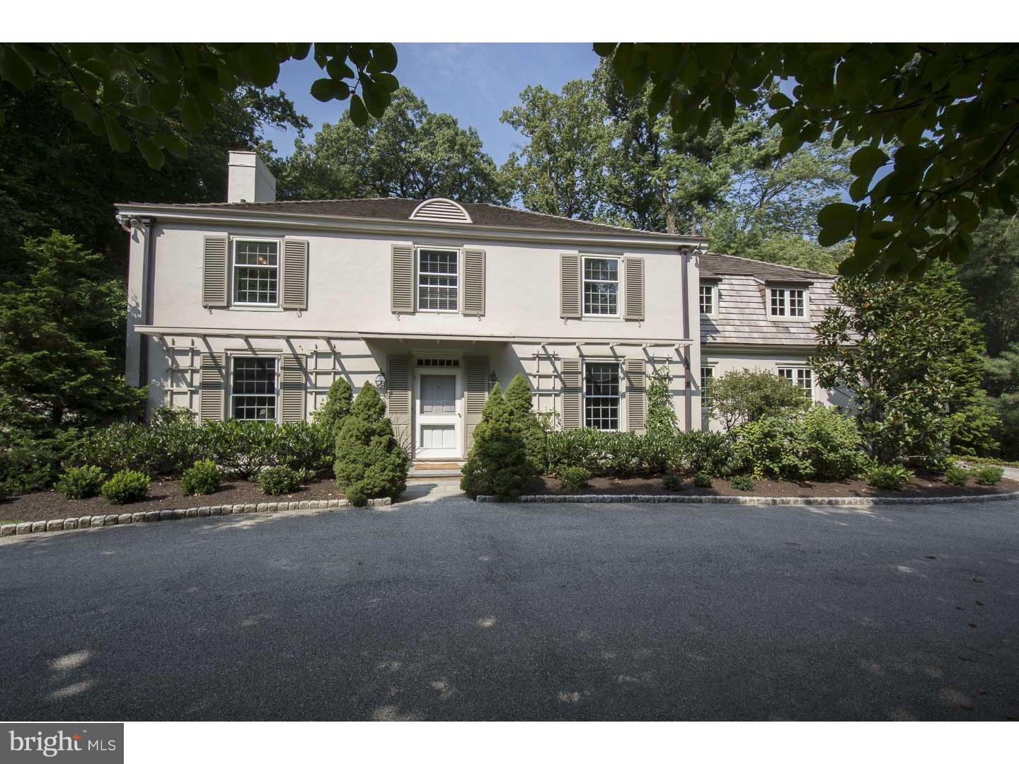 Accessed by a sweeping cobbled edged drive & located on one of Bryn Mawr's most desirable streets & neighborhoods, find this sophisticated 5 bdrm, 4/2 bath French-Styled Colonial offering thoughtfully & recently updated interior spaces with superior finishes in a traditionally-styled yet open, bright connected floor plan. A wide transverse Foyer with richly stained hardwood floors opens ahead to the formal LR brightened by two walls of windows. This elegant space showcases a detailed wood-burning fp & a set of transformed French doors which lead to a spacious bluestone terrace, pool & verdant lawn. A wall of custom wood shelving with storage cabinetry beneath provides elegant display space on either side of double paneled-doors to a large, gracious DR. With intimate or grand scale entertaining in mind, the DR is positioned centrally to allow access from the Foyer, LR, FR & Kitchen, & boasts an oversized window, bathing this room in natural light & inviting views of the surrounding gardens & mature trees. Sparkling all white Kitchen with grey granite counter-tops & center-island cook top offers Subzero refrigeration/freezing, Miele dishwasher, double wall-ovens & plentiful flat prep & storage cabinetry. Steps away, find the Breakfast area overlooking the stepdown FR. The 2000 Family Room addition provides the desired informal space that most other homes of this vintage are lacking. High ceilings, 3 exposures of light, including French door access to the patio & pool & a brick surround gas burning fireplace combine to create a space that is as highly functional as it is welcoming. Tucked off the Foyer & ideally located for a private conversation or fireside relaxation find a handsome Den with angled brick detailed fireplace & eastern & southern facing windows. Ascend a wide turned stair to the Master Bedroom retreat highlighted by 3 closets, built-in dresser & adjoining fresh, white tiled bath, with wash stand height vanity, standing shower & linen storage. 4 bright, generously sized family bedrooms, one currently purposed as a home office; 2 share a Jack & Jill bath while the other 2 bedrooms enjoy en-suite baths. Linen storage & laundry area complete this level. Lower level offers finished recreation area with engineered floor, wall of shelved enclosed storage & daylight windows. A craft sink, half bath & generous primary storage & mechanicals. An immaculately presented home in move-in ready condition. An exceptional home in an exceptional setting.