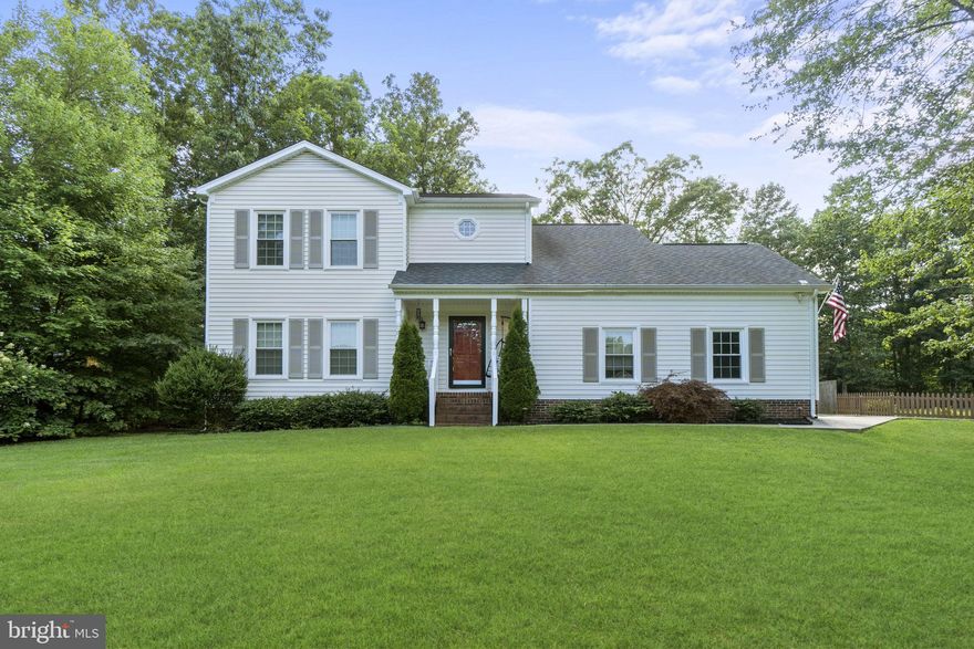 Own this beautiful home in in Queen's Mill. This 2 level home sits back in a private setting. The backyard is flat and fully fenced in, 2 concrete pads, deck, and great for entertaining. Main level  welcomes you, with a huge family/living room, a separate dining room, the kitchen features large center island, granite countertops, stainless steel appliances. Family/Rec room off the kitchen, has vaulted wood ceilings,  skylights, wood burning brick fireplace. Upstairs has 3 bedrooms & a beautiful loft with barn door, opened to lower level, but could be converted to a 4th bedroom, a great size primary suite, beautiful primary bathroom, huge tiled shower with 2 shower heads, double sink, side load 2 car garage with additional door into back yard. Close to schools, shopping, dining, VRE.