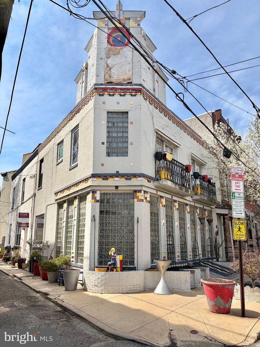 Step into this one-of-a-kind 3-bedroom, 2-bath corner home in the heart of Queen Village, where vibrant Art Deco style meets modern comfort. Bursting with color and character, this home offers a truly unique living experience filled with charm and personality. The spacious, light-filled living room welcomes you with an abundance of natural light, creating an inviting space perfect for relaxing or entertaining. The open-concept dining area flows seamlessly into the kitchen, making it ideal for gatherings and everyday living. From the kitchen, step directly out to your private backyard—perfect for outdoor grilling. Upstairs, the primary suite features its own ensuite bathroom, providing a private retreat within the home. Two additional bedrooms offer flexibility for guests, a home office, or creative space. Throughout the house, you’ll find generous closet space, offering plenty of storage rarely found in city living. Additional highlights include a basement with a washer and dryer for added convenience, and the added privacy and natural light that comes with being a corner property. Located in sought-after Queen Village within the highly desirable Meredith School District, this home offers the perfect blend of artistic flair and everyday practicality. Enjoy being just steps from a wide variety of shops, restaurants, and parks, making city living both vibrant and convenient.