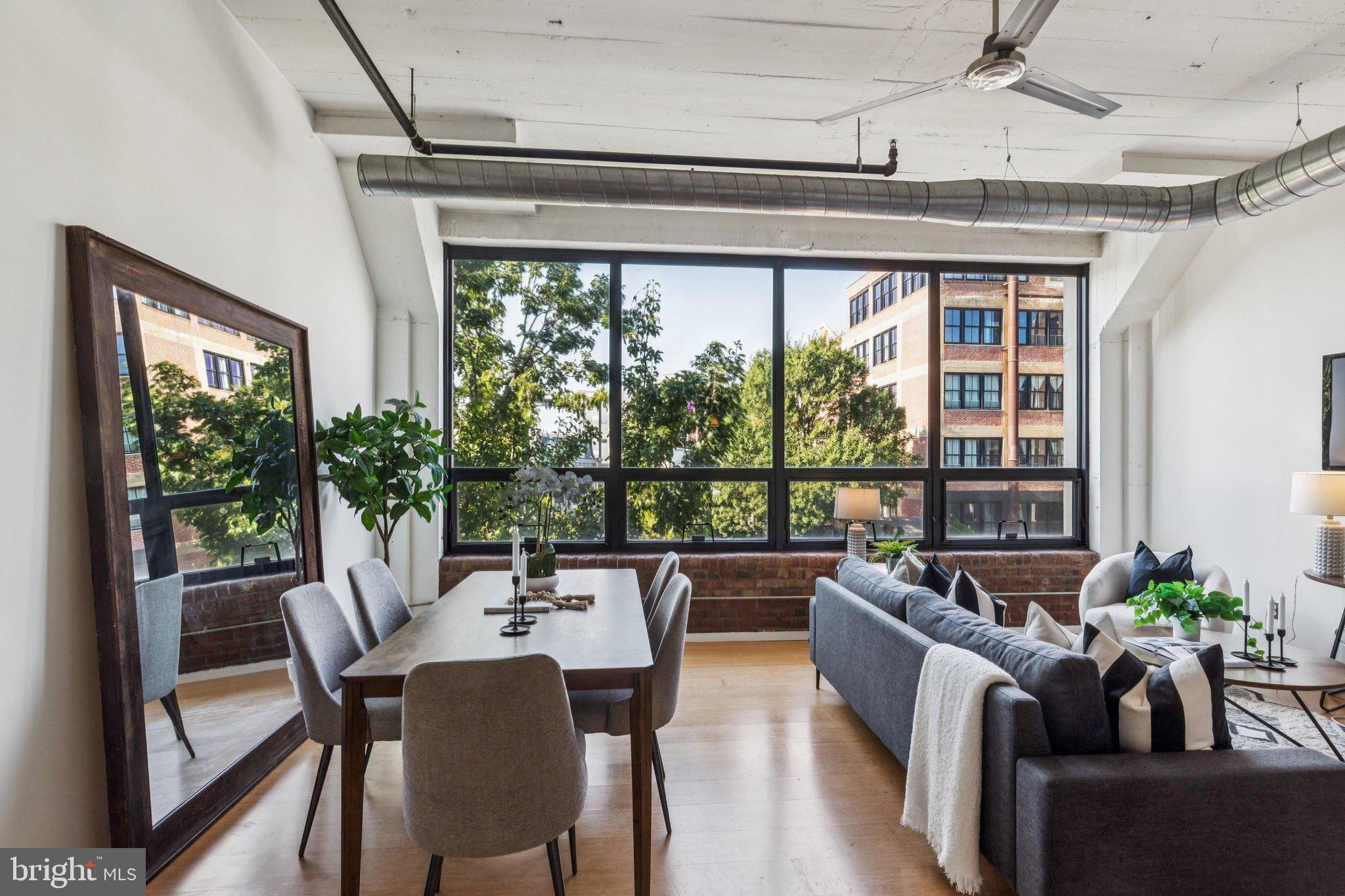 One-Car Parking Included | Prime Fishtown Loft Living | Freshly Painted & Staged — Buyer’s Choice of New Flooring with Acceptable Offer
Welcome to Unit 211 at Memphis Flats — a bright and stylish south-facing one-bedroom, one-bath loft that perfectly blends modern convenience with authentic industrial character.
This expansive condo showcases soaring 12-foot concrete ceilings, exposed brick, bamboo flooring, and oversized factory-style windows that drench the space in natural light. The open kitchen features stainless steel appliances, sleek cabinetry, and plenty of counter space. A Bosch washer/dryer is tucked into a separate laundry closet, and thoughtful storage is found throughout.
Included in the sale are one reserved off-street parking space and a private 3'6" x 8' storage unit — true city luxuries.
At Memphis Flats, enjoy boutique amenities such as a newly renovated fitness center, secure bike storage, and a stylish resident lounge. Step outside and you’re instantly immersed in Fishtown’s vibrant energy of cafes, boutiques, and acclaimed nightlife.
This is loft living at its finest — spacious, convenient, and unmistakably cool.