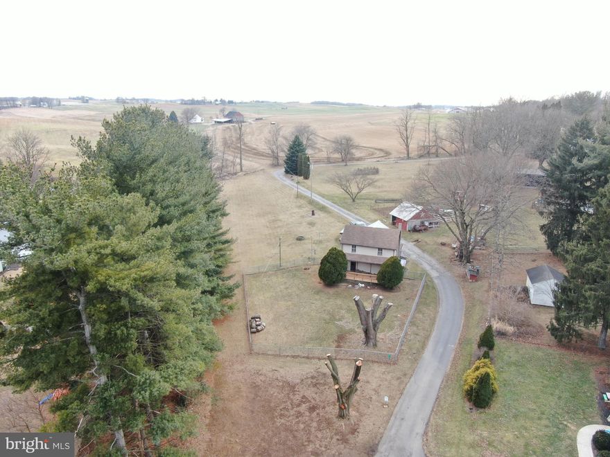 COME AND ENJOY COUNTRY LIVING! Nice home on 1.8± acres with beautiful views! The home features 2 bedrooms, 1 bathroom, office, living room, kitchen, dining area, mud room, basement, and detached 19x19 garage/barn with loft. Incredible views of the surrounding farmland.
