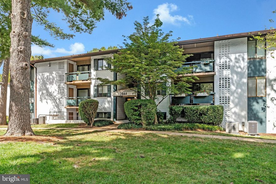 Charming One-Bedroom unit featuring a private fenced-in backyard with a Covered Patio- perfect for relaxing, entertaining and gardening.  Inside you'll find hardwood flooring throughout the living area, a spacious Living Room with a Triple-Slider overlooking the backyard, an Updated Kitchen with Tile Flooring, Maple Cabinets with undermount lighting, Granite countertop with tiled backsplash, Stainless Steel appliance, Gas cooking and a Pantry. The Separate Dining Room overlooking the back yard can also be used as a home office.  The Bedroom features Two Closets - the large Walk-In closet has custom Built-Ins/drawers. Updated Bathroom with Ceramic Flooring.  Linen closet, Full sized Front Load Washer and Dryer. Updated interior doors, newer Heat Pump, Microwave & Dishwasher.  Storage Room with Cage along with Bike Storage. Condo fee includes water, sewer & trash & Outdoor Pool. Plenty of parking for you and your guests. Located just minutes from the Mosaic Districts restaurants and shops, major routes and a bus stop just steps away.