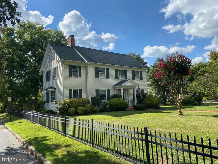 Beautifully updated home on Easton's premier residential block. a short distance to the downtown, Idlewild Park the "Y", and the Academy Art Museum.  Brick and flagstone walkways.  Traditional center-hall colonial with   9 ft ceilings and oak floors.  Living Room with fireplace.  Dining Room, with built in corner cupboards.  Eat-in kitchen with top-of-the-line refrigerator, decorative tiles.  Cheery sunroom with south bay window.  Three or four Bedrooms, 2 1/2 baths. Principal Bedroom has four closets, and newly remodeled principal Bath has heated tile floor, marble shower surround.  Third story can be utilized as a large home office or as a dormitory. Central A/C. Hardwood floors.  Newly installed "Levelor" privacy blinds. Screened porch. Detached garage, beautiful flower garden within a fully fenced yard. Brick and flagstone walkways. Alley in rear.