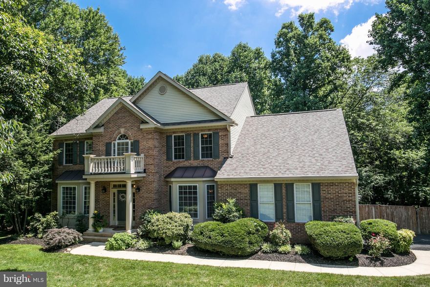 Beautifully maintained inside and out with many upgrades.  Kitchen features granite, Stainless Steel, tile backsplash, island cooktop, double ovens. New roof, gutters, and downspouts 2017. 4 full bathrooms upgraded, new carpet installed 2018, sanded and painted deck.  2 large flat areas for volleyball, outdoor enjoyment or add your own in-ground pool!  Ask your agent for the upgrades/updates sheet