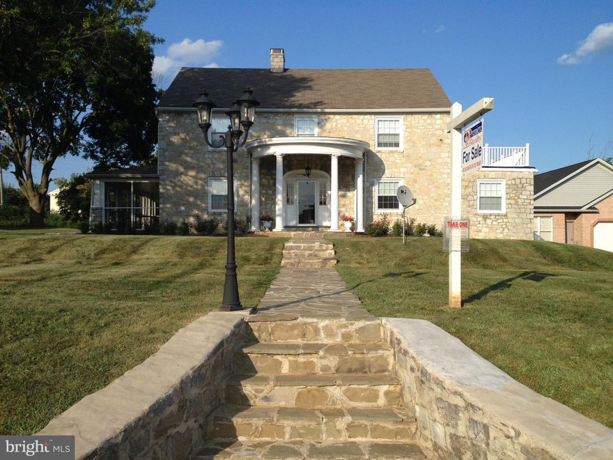 Beautiful, luxurious 5 bedroom, 2.5 bath unique all stone colonial with many updates! Grand foyer opens to large family room with fireplace and screened porch for summer enjoyment. The formal dining room leads to a sitting room and large eat-in kitchen. Down the hall is a bathroom and office/den. Upstairs offers 2 bedrooms, bath and master suite with patio doors to rooftop deck! HMS warranty incl.