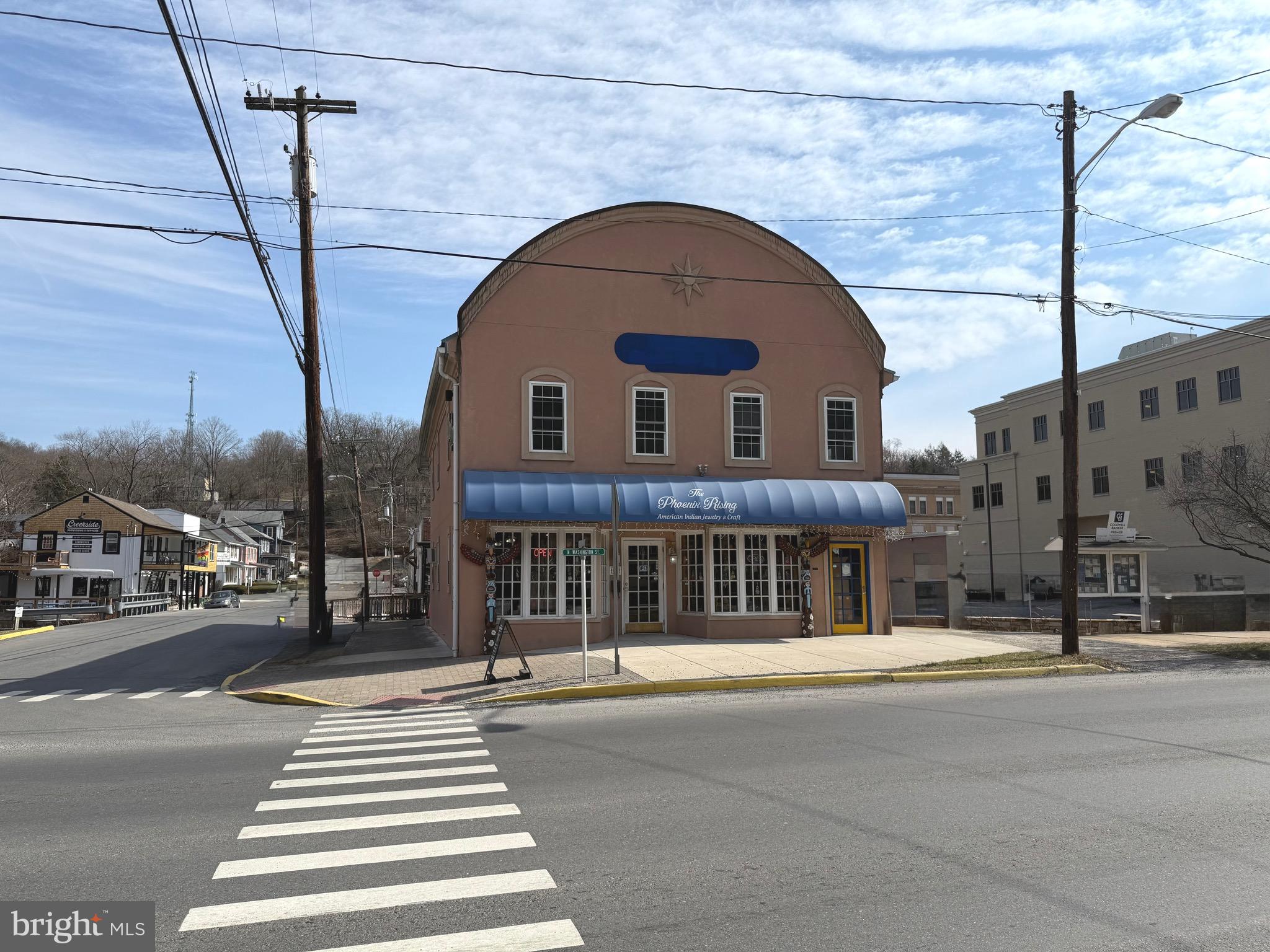 BERKELEY SPRINGS IS A GO TO DESTINATION! Consider the potential opportunities for your new commercial venture at this .26-acre property in downtown Berkeley Springs. Renovated in 2002-2003, the property boasts a spacious open area, half bath, and office space on the main level. The upper level features separate access, an open area, built-in bar, two half baths, and space for a kitchen. Although some refurbishment is required, the property's prime location near spas, artsy shops, restaurants, and breweries makes it a promising investment. What are you waiting for? Come enjoy small town living at it's best!
