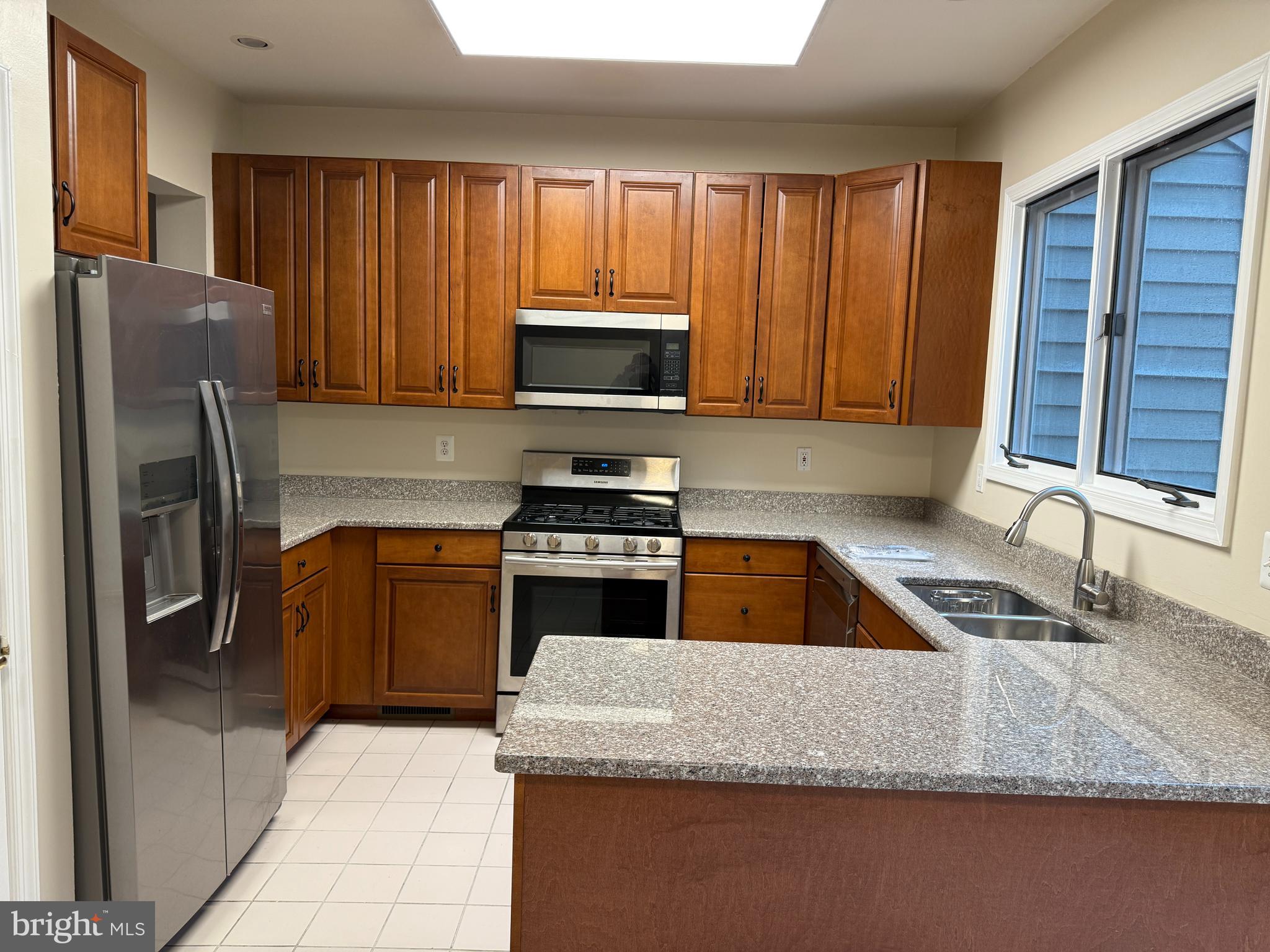 GORGEOUS 3 BED/2 FULL BATH/2 HALF BATH LUXURY TOWNHOUSE W/GARAGE. BRIGHT & OPEN FLOOR PLAN! FRESHLY PAINTED. UPDATED KITCHEN W/ GRANITE COUNTERS STAINLESS STEEL APPLIANCES + LARGE BREAKFAST ROOM. HARDWOODS ON MAIN LEVEL. NICE SIZE LIVING ROOM/DINING ROOM WITH 4 SIDED FIREPLACE, BAY WINDOW+9 FT CEILINGS. RECESSED LIGHTING. PRIMARY SUITE W/ WALK-IN CLOSET+SUPER BATH W/WHIRLPOOL TUB,SEPARATE SHOWER+DOUBLE VANITY. FAMILY ROOM W/ POWDER ROOM. GAS HEAT+ GAS COOKING. GREAT LOCATION! PIKESVILLE SCHOOLS! OWNER PAYS HOA FEE. AVAILABLE IMMEDIATELY!