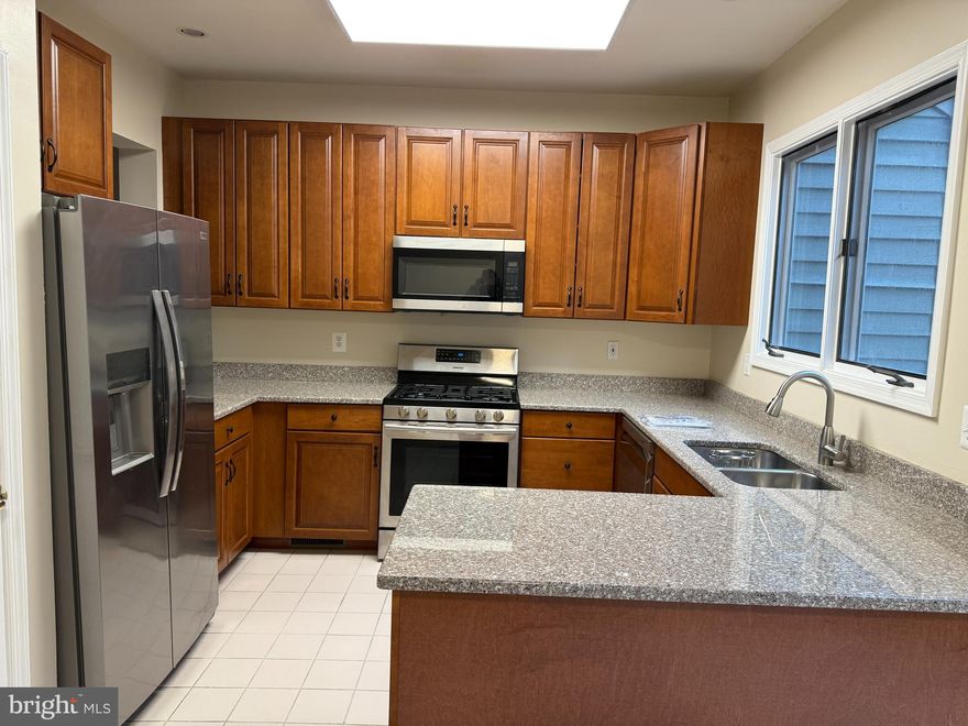 GORGEOUS 3 BED/2 FULL BATH/2 HALF BATH LUXURY TOWNHOUSE W/GARAGE. BRIGHT & OPEN FLOOR PLAN! FRESHLY PAINTED. UPDATED KITCHEN W/ GRANITE COUNTERS STAINLESS STEEL APPLIANCES + LARGE BREAKFAST ROOM. HARDWOODS ON MAIN LEVEL. NICE SIZE LIVING ROOM/DINING ROOM WITH 4 SIDED FIREPLACE, BAY WINDOW+9 FT CEILINGS. RECESSED LIGHTING. PRIMARY SUITE W/ WALK-IN CLOSET+SUPER BATH W/WHIRLPOOL TUB,SEPARATE SHOWER+DOUBLE VANITY. FAMILY ROOM W/ POWDER ROOM. GAS HEAT+ GAS COOKING. GREAT LOCATION! PIKESVILLE SCHOOLS! OWNER PAYS HOA FEE. AVAILABLE IMMEDIATELY!