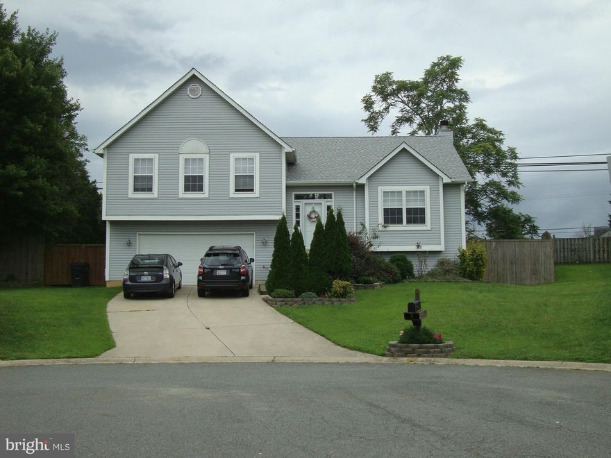 EASY COMMUNITING just off Rt 228, near by SEVERAL MILITARY BASES. Well kept home CUL DE SAC LOCATION w/4 bedroom,  3 baths, large family room with wood burning fireplace, walkout finished bsmt, full mstr bath, hardwood floors, open kitchen w/island & dining area, lots of cabinet & countertop space, 2 car garage w/storage, large deck overlooking fenced backyard & 2 sheds.  Pets case by case