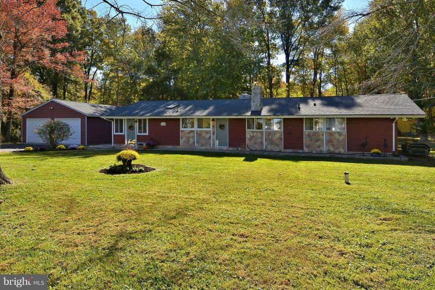 Showing for Backups!  3 BR, 2 BA, 1625 SF Single Story Home with Detached 2 Car Garage on a 1/2 Acre Level Lot Steps to the Water.  Relax in Your Large Living Room w/Vaulted Ceilings and Wood Burning Stove.  LOVE the Abundant Windows Looking onto the Large Deck in Your Large, Fenced Private Yard---Just Waiting for Pets and Soccer Games!  Large Detached 2 Car Garage-Community Offers Boat Ramp.