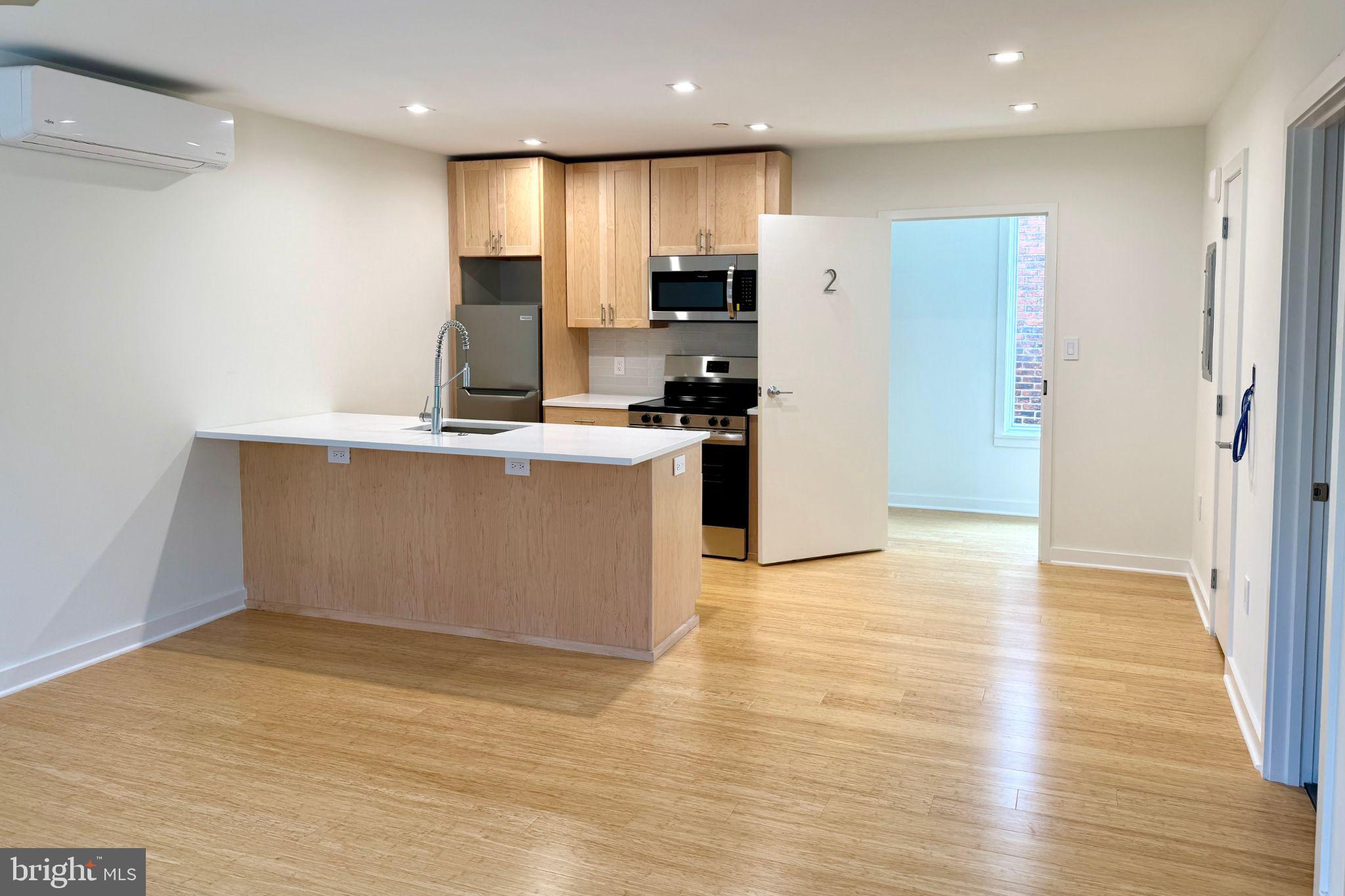 Be the first to live in this bright, brand-new 1-bedroom, 1-bath apartment located between Point Breeze and Newbold. With high ceilings and an open-concept layout, this thoughtfully designed home blends contemporary style with everyday comfort. The sleek kitchen features stainless appliances, quartz counters, subway tiled backsplash and a breakfast bar for casual dining, opening seamlessly into the living area—perfect for entertaining or quiet nights in.
The bedroom offers generous closet space and large windows that bring in tons of natural light. A warm, modern bathroom, in-unit laundry, and ceiling fans in both the living room and bedroom add to the home’s comfort and convenience. Pet-friendly, too.
Set in a rapidly growing part of South Philly, you're just steps from local favorites and exciting new spots—including a yoga and Pilates studio, Schmaltz, Groom and Board doggy daycare, Rowhouse Grocery, and Luhv Vegan Bistro—plus longtime staples like American Sardine Bar. With easy access to the Ellsworth-Federal and Tasker-Morris BSL stops, Center City is just minutes away.