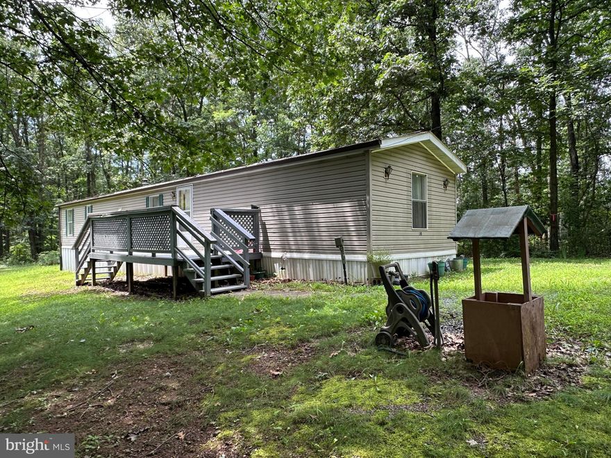 LOW COST LIVING....ADORABLE AND AFFORDABLE....1995 SKYLINE 14X70 MOBILE HOME ON NICE 2.7 ACRE WOODED LOT, PRIVATELY LOCATED AT THE END OF THE ROAD. EASY ACCESS, ONLY 1/2 MILE OFF THE PAVED ROAD AND LESS THAN 10 MINUTES FROM CONVENIENCES. NICE SHED IN THE BACK AND A CUTE LITTLE YARD FOR YOUR PUP TO RUN AROUND. 3 BED, 1.5 BATH, OIL FURNACE LESS THAN 2 YEARS OLD, NO A/C, NICE SCREENED PORCH WITH RAMP ON THE BACK. IT NEEDS A LITTLE COSMETIC TLC BUT NOT MUCH....ORIGINAL FLOORING..... FOR A 30 YEAR OLD TRAILER....IT'S IN PRETTY GOOD SHAPE. IF YOU NEED FINANCING, YOU'RE GONNA NEED TO USE A LOCAL BANK AND PUT 20% DOWN. THIS ONE'S TOUGH TO BEAT FOR 90K, IT'S THE PICK OF THE LITTER FOR UNDER 100K IN HAMPSHIRE COUNTY!