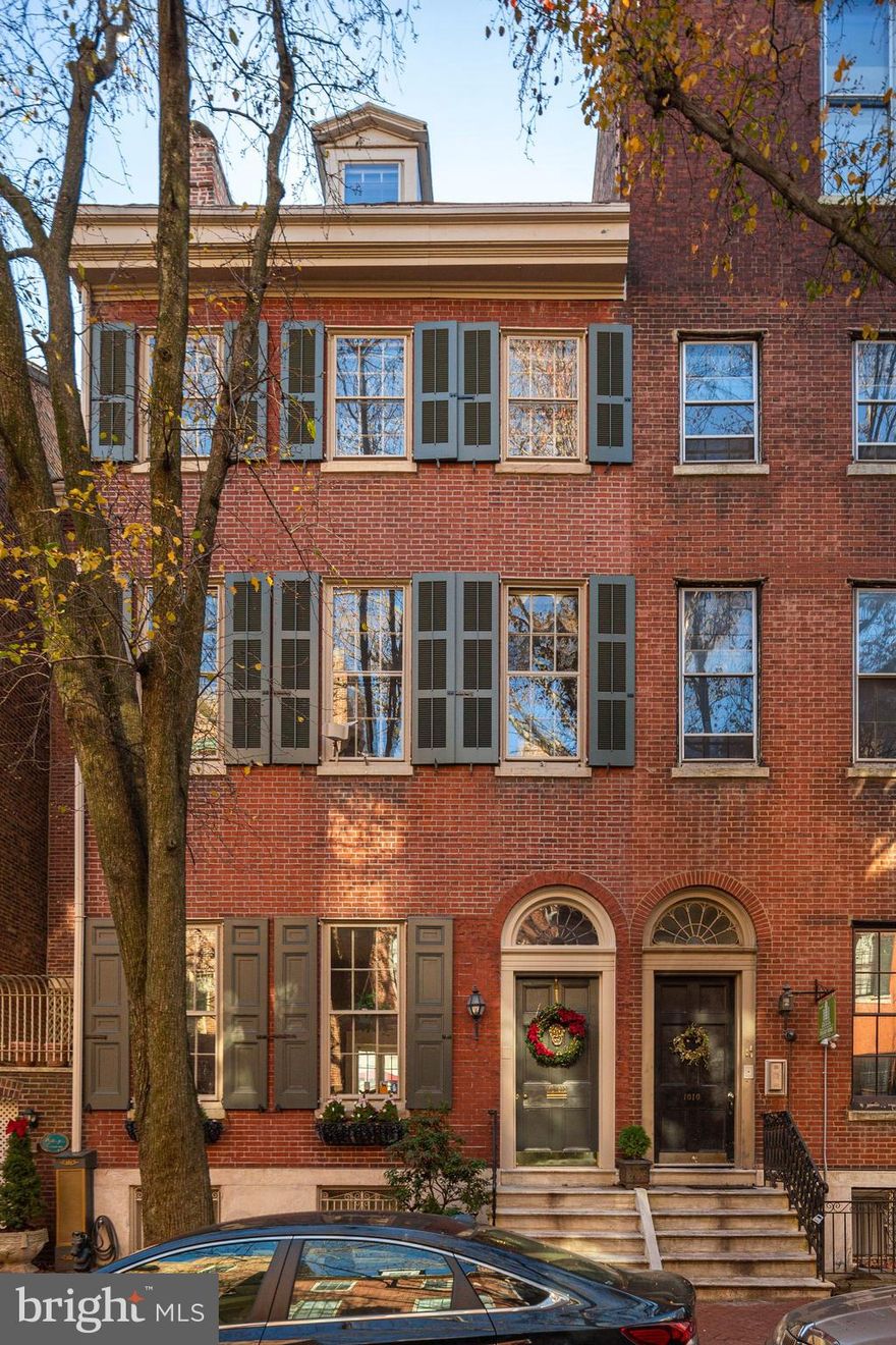 Nestled in one of the only two blocks of Clinton Street, this 6-level home will exceed your wildest
Expectations. With dazzling light streaming through a Palladium Window, 13” ceilings, and
plaster moldings, this home is steeped in grandeur and history. Historically authenticated, 1842,
this home flows naturally from room to room while including comfortable spaces and optimal
Privacy. The dramatic first floor, with decoratively painted plaster moldings, is home to two
wood-burning fireplaces surrounded by marble and alabaster mantels. A wall of glass includes
opulent French Doors providing seamless access to the open-air garden deck + breezeway.
The garden deck flows toward the operable wall of glass to a one-of-a-kind
Conservatory...apropos of Longwood Gardens. Floors 2, 3 & 4 are intentionally set for use as
suites offering one bedroom, one full bath, and a sitting-room that can also be used as a work-from-home office. Bathrooms (4) and kitchenettes (3) that enable occupants who may choose contained, fully appointed living spaces. 1.5 block stroll from two Medical Centers: UPenn-Pa & Jefferson Hospitals. Countless interior historic appointments. Ceiling moldings, stellar maintenance. Historic (alabaster/ marble) mantels, (3) Wood burning fireplaces, 13 -foot ceilings bring grandeur and a sense of vastness. Where: 1008 Clinton Street a tree-lined enclave within Washington Square West. This grand, 170-year-old home uniquely and graciously addresses fine living in these changing times. 5645 square feet. Buy for $1,680,000!