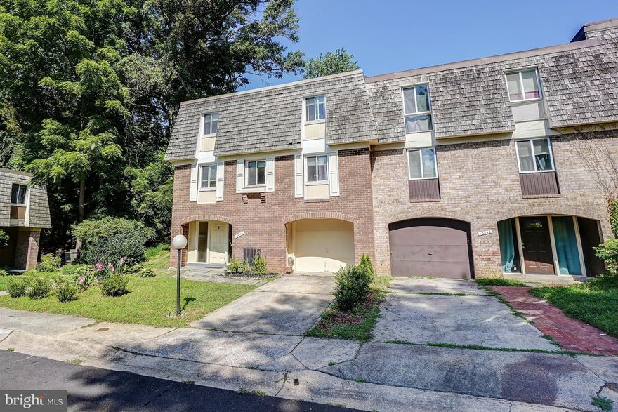 This corner TH is huge, see SF. It has an extra long garage to fit 2 cars on line or for extra storage. Basement is ground level on the front. Gleaming hardwood floors all over except for a smal portion, large renovated kitchen/FR with granite counter tops and oversized refrigerator. Good size back yard too backing to common grounds.