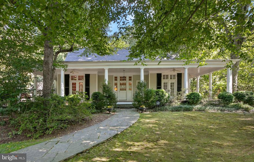 Welcome to this custom-built, bucolic country-style home, an expanded replica of a prominent pre-war Georgian property reimagined by Anne Decker and masterfully built by Hopkins and Porter. Sitting on over 4900 SQFT on a private lot backing to preserved parkland and surrounded by mature foliage, this 5-BR, 4.5 BA turnkey residence offers the perfect marriage of history and charm with modern upgrades. Upon entrance from the breathtaking, wrap-around front porch, a grand Foyer opens to the oversized Living Room centered on a wood-burning fireplace and framed by a row of French exterior doors with beautiful green views. A set of oversized pocket doors adorned with transom windows connects to the renovated Chef’s Kitchen featuring brand new Quartz countertops, GE Café appliances and flooded with natural light, which accesses the spacious Dining Room via a Butler's Pantry. Walk down the annex replete with floor-to-ceiling Pella windows to your main level Primary Bedroom boasting a vaulted ceiling and two sets of double French exterior doors. A newly renovated Primary Bathroom with oversized marble floor, double sinks and a unique soaking tub accesses a large walk-in closet. The remainder of the main level consists of two large secondary bedrooms connected by a spacious full Bathroom with brand new tile. The upper level features a sun-soaked, flexible space ideal for a fourth Bedroom or the perfect work-from-home Office and complete with a full Bathroom. On the lower-level, two distinct living spaces connect to the perfect Au Pair suite with a full sitting room accessing a fifth Bedroom and fourth full Bathroom. The beautiful and secluded neighborhood boasts 81 custom built homes on a sprawling 204-acres, offering an equestrian center with groundkeepers and barn staff, miles of private hiking and riding trails and views of the Potomac River.