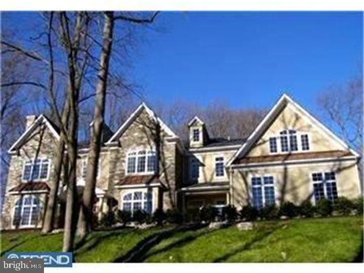 Magnificent European Manor Home "Quarry Hill"... 4/5 bedrooms, 4 1/2 baths, elaborate millwork, soaring ceilings, superior finishes of granite, marble & imported tile, chefs kitchen open to a 2 story family room with floor to ceiling stone fireplace, wall of windows, built-in media center, custom wet bar, paneled study, & French doors to a flagstone terrace with pergola. The second floor offers master suite with sitting room, walk-in closets & luxurious master bath with amenities, enormous steam shower, 2 linen closets, whirlpool tub, 2 vanities & separate water closet. Oversized 4 car attached garage, custom built-ins throughout & magnificent lighted landscape design. Situated in the heart of Radnor Township. it is privately set atop a scenic glen & offering complete privacy. Buyer says bring all offers!!