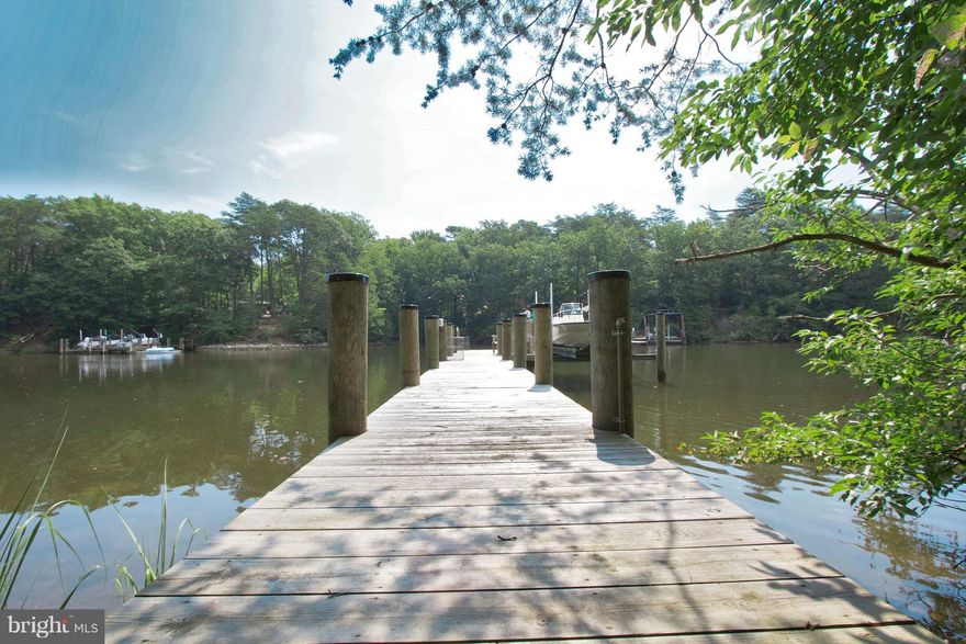 Champagne taste with a Beer budget?  This is the perfect retreat after a long week! Just bring your camper or stake a tent to start your break from reality!   30&50 amp hook up for a  Camper with additional 30&50 amp at side of shed. Electric ran to pier, additional shed on way to pier w/ full electric on both sides.15k lb boat lift. Waterline is currently run to pier for future hook up.  Deep water 8ft!! NO PERC