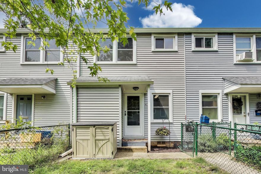 This updated 2-bedroom, 1-bath townhome is tucked at the end of a peaceful cul-de-sac in the Greenbelt Homes Co-op, bordered by protected woodlands. It features fenced front (garden side) and rear (service side) yards, and an assigned parking space with plenty of guest spots.

Inside, luxury vinyl plank flooring on the main level and hardwoods upstairs. The open kitchen (appliances replaced in 2024) and bath were renovated within the last two years with modern finishes, white cabinets, stainless steel appliances, and spa-style tile. Recent windows and storm doors add light and energy efficiency.

The main level offers a bright living room, separate dining area with patio access, and a convenient laundry closet addition (energy efficient heat pump dryer). Upstairs includes two sunlit bedrooms, a remodeled full bath, and access to attic storage. Updated electrical service adds additional outlets on the main floor as well.

The Co-op fee covers property taxes, major interior/exterior maintenance, structural systems, and reserve funding. Enjoy a historic community with green spaces, trails, parks, pools, and quick access to Metro, NASA, and commuter routes.