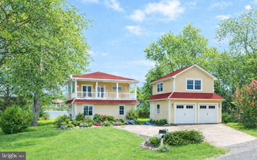 Please Note, There are numerous garage options available.  2 story option listed at 1.2 million.,  1 story garage option listed at 1, 025,000.00.  Garage option is TO BE BUILT.  this construction will  start after settlement.     charming, nantucket style home offers unique privacy with the advantage of being in a wonderful water privilege community.  Rare 1.5 acre lot, this 5 bedroom, 3.5 baths offers upgrades galore, including true hardwood floors, stunning renovated kitchen and baths, new windows,siding, and doors.    There are views from almost every room.  The community boat ramp is directly across the street, for easy drop off of of your boat.