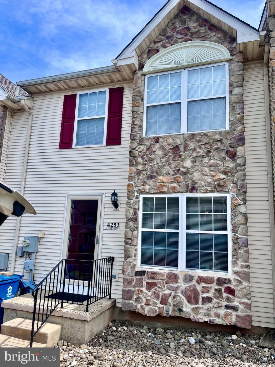 Welcome to this beautifully maintained townhome tucked away on a quiet cul-de-sac in desirable Fairlawn Court. Offering the perfect blend of comfort, privacy, and convenience, this home is move-in ready and designed for easy living.
Step inside to a flexible front living or dining space, highlighted by deep-sill double windows that fill the room with natural light. The eat-in kitchen features stainless steel appliances and flows seamlessly into a spacious family room complete with a corner marble fireplace and sliding doors leading to a freshly painted deck overlooking the fenced backyard—perfect for relaxing or entertaining. Both spaces are enhanced with brand-new carpeting.
The first floor also includes a convenient powder room with a dedicated laundry area, complete with washer and dryer.
Upstairs, you’ll find three nicely sized bedrooms with ample closet space and a shared full bath. The sunlit primary suite offers hardwood floors, three spacious closets, and a private full bath, creating a comfortable retreat.
The finished walkout basement adds even more living space, featuring new carpeting, bright recessed lighting, and sliding doors to a ground-level patio and fenced yard—ideal for recreation.
Additional highlights include parking for two cars right at your front entry, with additional parking just steps away. Ideally located near local schools, shopping, dining, and the charming destinations of Skippack and Collegeville, with quick access to major highways for an easy commute.
Enjoy low-maintenance living with the added benefit of privacy—welcome home. Listing Agent is related to one of the sellers.