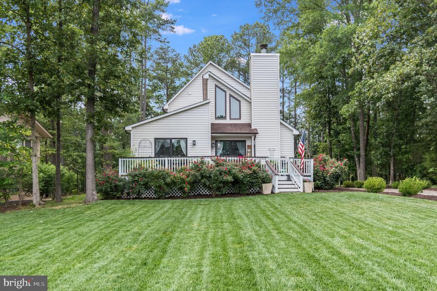 This is it!  If you have been searching for the perfect water view, look no further.  This charming cottage has been lovingly updated with all the upgrades you have been looking for.  The kitchen is well equipped with Kitchen Krafters soft close cabinets, brand new stainless steel appliances, under cabinet lighting, beautiful quartz and a stunning farmhouse sink.  The kitchen island is a central spot to gather and take in that stunning view.  The living room is so light and airy with vaulted ceilings, exposed beams and a stone gas fireplace which draws your eye back to that water view.  Stepping outside you will love the large deck which is perfect to gather and relax.  Fireworks on your mind?  You will have the best view as they are set off at the dam, which is right in front of you!  Back inside the two bathrooms have been beautifully updated and the primary suite is located on the main floor.  Upstairs you will have two large bedrooms and a bathroom.  Outside you will love having an inground sprinkler system and beautiful landscaping.  Lake of the Woods is a fantastic community with more amenities than you can imagine.  This house is located just steps away from the marina, where you can rent a boat slip.  Enjoy walking?  You can easily access the walking trail which in less than a mile will take you to the Clubhouse for sunset dinners, you can enjoy the main community pool, the gym, one of the many tot lots, and also large beach!  
Come take a look, I know you will fall in love!