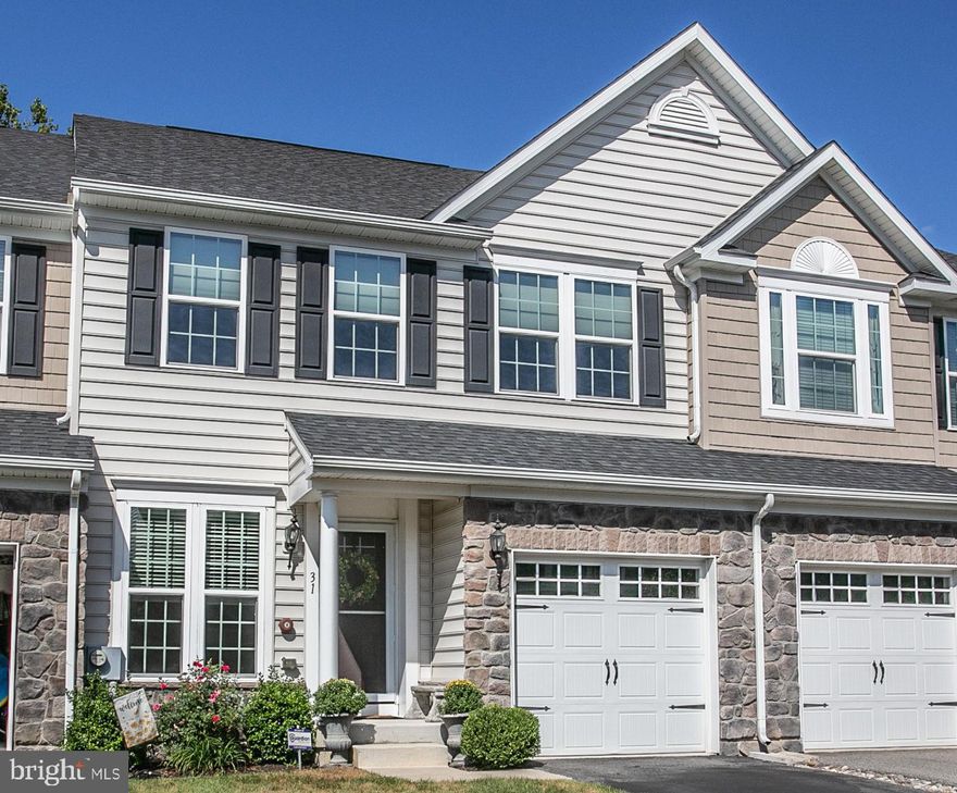 Welcome to 31 Hawkswell Circle, an 8 year "young" townhome offering 3 bedrooms and 2.5 baths in Springfield Township.  Better than new with custom painting, new carpeting, new hot water heater, room darkening shades and ceiling fans in all the bedrooms.  Hardwood floors throughout the first floor, custom molding and millwork throughout, cathedral ceilings in all the bedrooms and an abundance of recessed lighting.  The kitchen boasts granite countertops, custom 42" cabinets,  stainless steel appliances with gas stove and built-in microwave, a double sink AND a large pantry.  A peninsula provides additional prep space and seating, and there is also a breakfast area with French door to the oversized Trex deck.  With privacy screens on the deck you can truly enjoy a peaceful morning cup of coffee or your evening adult beverage!  The main level also has a combined living/dining room area, a large family room with gas fireplace and a half-bath.  The open floor plan of this level is great for entertaining as well as everyday living.  Heading upstairs you will find a large primary bedroom with walk-in closet and two other nice sized bedrooms.  To keep you organized, all  the bedroom closets have been outfitted with California closet systems!  The primary bath has a dual vanity with granite countertops, tile floor, large tile surround shower with glass door,  and a separate soaking tub.  The hall bath has a single marble sink, tile surround shower/tub and tile floor.  There is also a linen closet in the hall AND the 2nd floor large laundry room has a washer, dryer and utility sink!  Not to be forgotten is the large, finished walk-out basement which adds   an additional 650 square feet of living space to the home.  In addition to recessed  lighting, there is plenty of natural light to enjoy this lower level living space with windows AND a French door to the large  EP Henry Paver Patio.  There is also an unfinished area for storage, AND it is plumbed if you decide you want to add a bathroom on this level.  A one-car garage with inside access and a security system complete the features of this home.  FUN FACT:  this home provides direct access to the Piszek Preserve, 36 acres of woodlands, wetlands, and meadows.  Enjoy the 0.6 mile walking trail  while you spy scarlet tanagers, great blue herons and other wildlife, OR if you enjoy history,  marvel at the Emlen House built in 1750 and used by George Washington in 1977 during the Battle of Whitemarsh.  Added to the long list of reasons why you want to call this home YOURS, 31 Hawkswell Circle is in the highly rated Springfield Township school district,  in close proximity to numerous private schools, minutes from major roadways and highways and two SEPTA rail stations, near several golf courses, shopping and dining. Don't delay, call for your showing today.