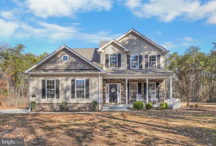 Welcome to this meticulously maintained, 5-year-old Colonial situated on a private 3+ acre level lot. This home has been occupied by only one owner since its completion and offers the modern features and energy efficiency of a newer build within an established, wooded setting.

Main Level Features
- Kitchen & Dining: The large kitchen features a center island and transitions directly into the family room and a separate formal dining room.
- Living Space: The open family room is anchored by a fireplace and designed for a functional flow.
- Convenience: A half-bathroom is located on the first floor for guests.

Second Level Layout
- Primary Suite: Includes a large walk-in closet and an ensuite bathroom with a spa-like bath with a double vanity.
- Additional Bedrooms: Three additional bedrooms are located on the upper floor, for a total of four bedrooms.
- Guest Bathroom: The hall bathroom is designed with space for a double vanity.
- Laundry: For added convenience, the laundry room is situated on the second floor near the bedrooms.

Exterior and Grounds
- Acreage: The property consists of 3+ acres of level land, bordered by trees at the rear of the lot for privacy.
- Amenities: A large hot tub is installed in the backyard, positioned to overlook the wooded perimeter.
- Property Site: The lot is level and cleared around the home, providing usable space for outdoor activities while maintaining seclusion from neighboring properties.

This home is equipped with updated mechanical systems and protective infrastructure, including a sump pump and a radon mitigation system. The home also features a built-in sprinkler system and a dedicated generator hookup to ensure power continuity. These features, combined with modern building codes, provide the structural benefits of a 5-year-old property.