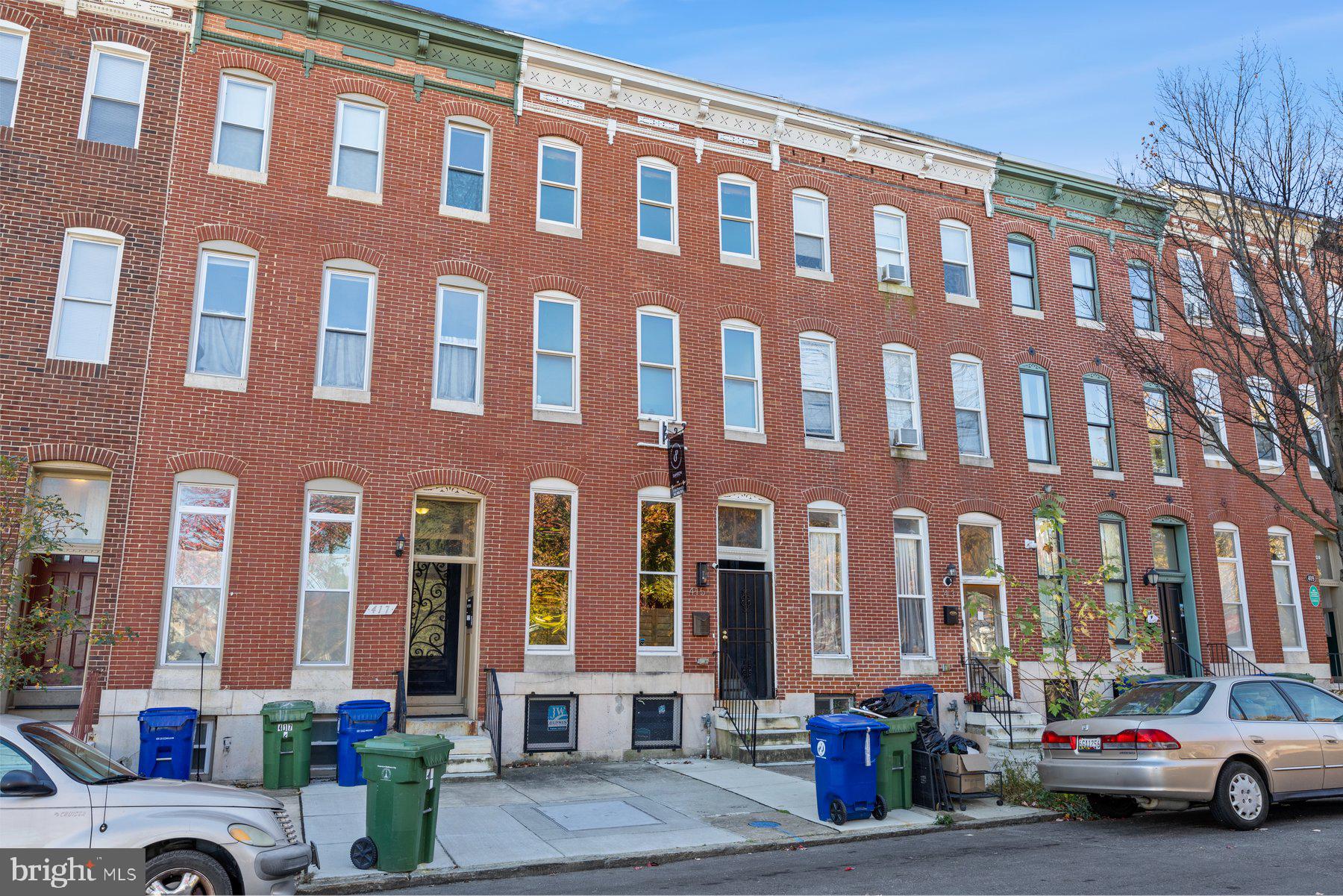 Stunningly Updated Rowhome in Station North! As you enter through the traditional four-panel door and classic vestibule, you step into a spacious living room. Elegant crown molding and historic baseboards add character, setting this home apart from typical renovations. Moving towards the back, you’re greeted by a vast, modern kitchen with updated wood cabinetry, stainless steel appliances, ample countertop space, and room for an eat-in area. The historic charm continues up the staircase, leading to the second level with two oversized city bedrooms and a stylishly updated full bath. The top level also offers two more large bedrooms and an additional full bath. One of the best features is the expansive basement, perfect for storage, a workshop, or crafting space, with room to grow. Parking for an oversized SUV in the back! Centrally located near I-83, Penn Station, Light Rail, and public transportation, this home is just minutes from shopping, dining, and entertainment.