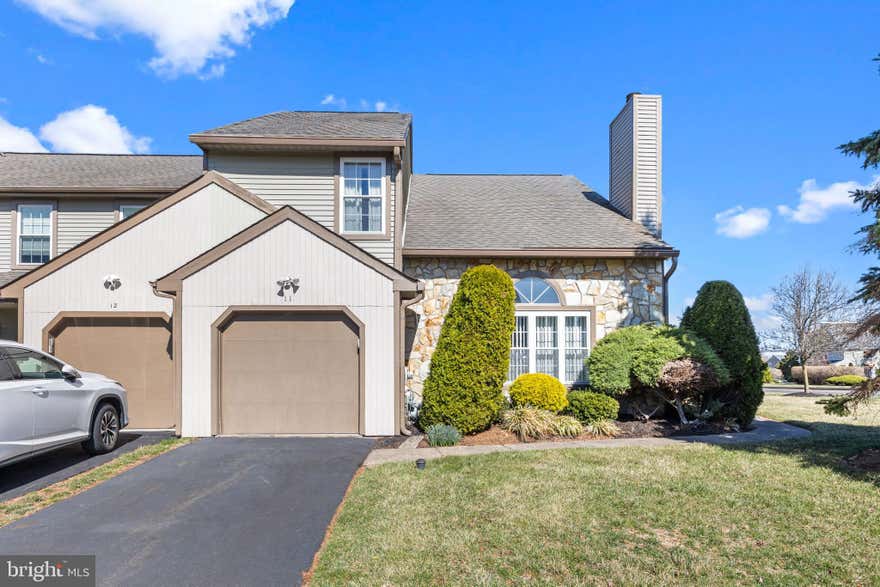 Amazing opportunity to build equity into a home in Newtown Township, Bucks County, PA! This 2 bedroom, 2.5 bathroom end of row townhome located in Newtown Grant and Council Rock School District is a diamond in the rough. This home just needs your loving touch and modern day design ideas to bring it up to speed. Situated on a premium corner lot on the outskirts of the Whispering Wood cluster, you will have easy access in and out of the development. Handsomely landscaped, there is an open space side yard, as well as a smaller fenced yard area to use for your outdoor enjoyment. Walking into the home, you will be delighted with the openess of the entry way leading into the large living room, with tons of natural light, 2 story ceilings and a wood burning fireplace. Beautiful hardwoods flow from the living area to the extra wide dining room with a bright bay window. The eat-in kitchen has a pantry closet, a nice amount of counter space for prepping food, gas cooking and a garden window which is the perfect place to showcase plants, grow herbs or simply add sunlight. Sliders from the kitchen lead out to the rear fenced yard with patio. The main floor laundry room is right off the kitchen, which also provides access to the one car garage. Finishing off the first floor, there is a powder room in the hallway and a coat closet with storage under the stairs. Upstairs, double doors open up to the super-sized owner's bedroom with ceiling fan and two closets, one being a 5' x 5' walk-in closet. The en suite bathroom has both a stall shower and a soaking tub. The vanity area is large enough to replace with double sinks. There is another spacious bedroom on the second level with two closets and direct access to the hall bathroom with tub shower. Original neutral colored hardwood flooring is located throughout the upper level bedrooms and hallway. Enjoy all of the amenities that the association has to offer with community events, pool, ball field, playground, tennis and basketball courts.