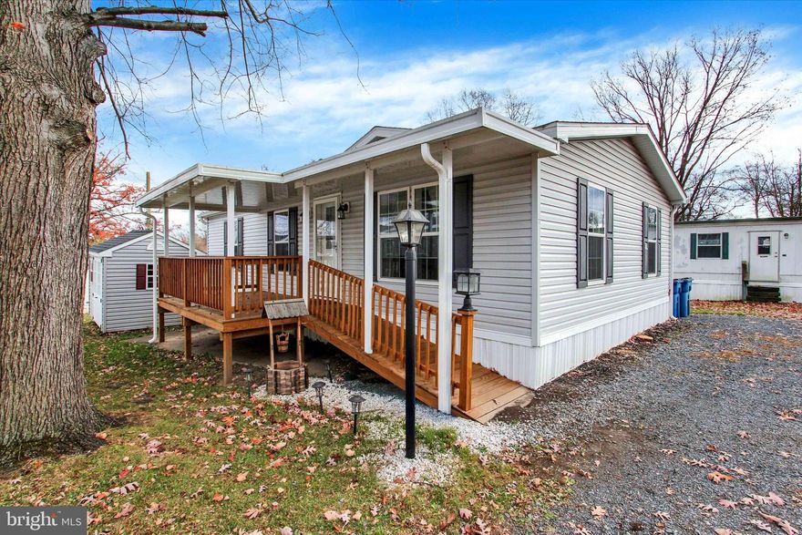 Welcome to 612 Range End Road in Dillsburg! This 2023 double-wide offers comfortable one-floor living with 2 bedrooms and 2 full baths. Enjoy easy access with a handicap ramp and covered deck. Inside, the spacious living room flows into a cozy dining area and a kitchen featuring upgraded high-definition countertops and a custom backsplash. The primary suite includes an upgraded walk-in shower. A nice wooden shed provides extra storage. Located in Northern York School District with affordable lot rent of $425/month, including trash and snow removal. Stop renting and start building equity today! Park approval required.