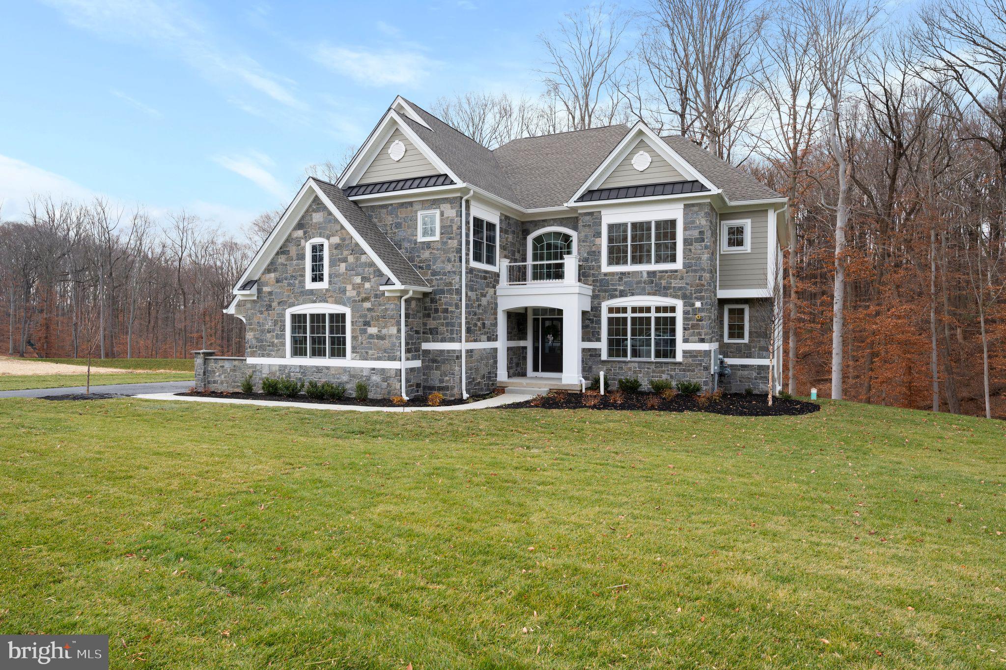 The well-designed Bellflower Model offers smart architecture for easy entertaining and everyday living with a long list of included appointments such as Real Stone & James Hardie Sided exterior elevations, Pella windows, rich interior moldings, wide engineered hardwood floors, side sweeping main staircase, solid interior doors, insulated interior walls, finished Lower Level with Den or Bedroom, daylight windows, walk out entrance and full Bathroom and the list goes on!!
Step into our Foyer and be welcomed with beautiful windows and natural light! Once inside, the Dining Room will delight you with its sophisticated tray ceiling and adjoining Butler's Pantry with glass front cabinets, ready to be the serving station for your next get together! The Gourmet Cook's Dream Kitchen will WOW you with an expansive 10’ Arched Center Island, Tall Painted Cabinets with Crown Molding to the Ceiling, Undercabinet LED Lighting, gleaming Quartz Countertops, equipped with the Thermador Stainless Steel Appliance Package, including Double Wall Ovens, Built in Microwave Oven, Stainless Steel Dishwasher, 5 Burner Gas Cooktop, Stainless Steel Hood, all overlooking a cozy Breakfast Room with a rear glass wall. On game day, your friends & family will enjoy watching their favorite team in the adjoining Two-Story Family Room, with a handsome fireplace and window wall. The First Floor also features a Guest Suite or Home Study with a large Walk-In Closet and Dual Access Full Bathroom. In addition, there is a convenient Mudroom Hall giving access to a Covered Outside Entrance, Three Car Garage, Coat Closet, and an Additional Walk-In Closet sized for a possible Future Elevator. The Second Floor offers a great design with a dramatic Balcony leading to the luxurious Owner’s Suite with a Bay Window looking onto the Rear Grounds, Volume Tray Ceiling, Dual Walk-In Closets, and a Spa Bathroom Retreat with a Free-Standing Soaking Tub, Spacious Shower with Frameless Shower Door and separate Wall Vanities. Three additional generously sized Bedrooms, Two Full Bathrooms, an abundant Linen Closet and a conveniently located Laundry Room outfitted with Cabinets and Utility Basin complete this level! Please note the Total Square Footage includes over 1,500 square feet of Lower-Level Finished Space with a Full Bathroom, Storage Closets, Daylight Windows, Walk-Out Entrance to a Garden Patio. We are Open by Appointment only, so please call for details and to schedule your tour! Public Water, Public Sewer, and Natural Gas. Photos are of the model home and may show options.