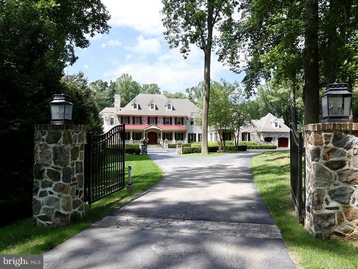 Extraordinary manor house takes classic detail & custom construction to new heights. Very private 6.44-acre setting in intimate, wooded Chadds Ford community combines natural beauty & commuter convenience; close to US 1. 13,000+ sq ft of living space on 4 levels, open floor plan with grand-scale rooms; extensive decorative mill work, interior stone detail, custom tiled bathrooms, brick and hardwood floors. Dream kitchen with every amenity, including top-of-the-line appliances. Walkout lower level with home theater, wet bar, rec areas, bedroom & bath. Outdoor living space features pool with fully equipped pool house, regulation tennis court, large stone-paved dining terrace with fireplace & grilling area.