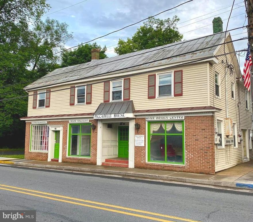 Commercial/Residential opportunity with loads of potential.  Formerly known as the "Piccadilly House" this property is located on South Main Street in Historic Edinburg, Virginia.  The building offers over 8,000 finished square feet split up between commercial space and three apartments.  The first level of the building offers commercial space with multiple entrances fronting South Main Street and two half baths.  Also on the first level in the back of the building there is a 2 bedroom, 1 full bath apartment with laundry hook-up and an entrance on each side of the building.  The upstairs offers two, 2 bedroom apartments, each with 1 full bathroom and laundry hookup.  The building is located close to many of the most popular restaurants and shops in Edinburg and it offers off-street and street parking.