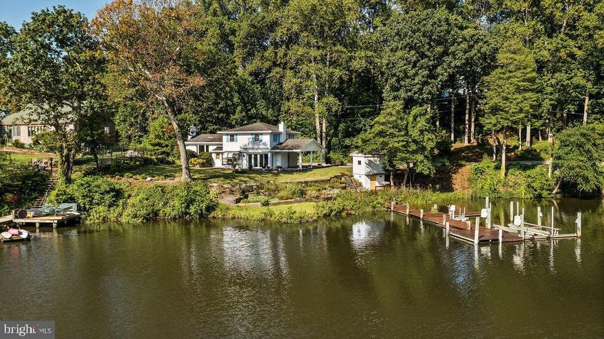 Park Creek has an entrance that allows for some larger yachts..mean low is 5 feet at the entrance!  There are several Large Yachts on near by piers, a 43ft Eastbay for instance!  
Sought after peninsula location on the "North Shore" of the Magothy River with easy access to the main channel.  Private protected cove with your own dock that has  5 feet of water  and 2 power lifts, 1 for a jet ski and a 10,000lb lift. Inside, this cute cottage has  wood burning fireplaces, a bright  living room with hardwood floors and a bay window with a panoramic view of Park Creek.  There is a large brick paver patio where you can relax as you watch ospreys and herons. Beautifully landscaped! 3 large bedrooms upstairs allow for great entertaining on the lower level indoors and out.