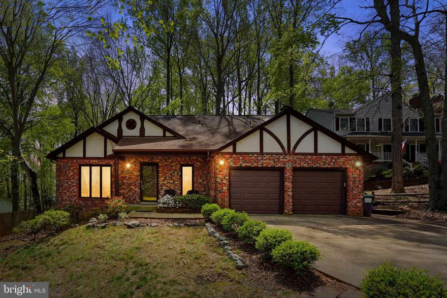 This one-of-a-kind home offers something truly special. A split foyer in this 3-level, 3 bedroom, 3.5 bath with 2-car garage already tells the story of a unique home with an embracing welcome. Boasting a superb location in sought-after, amenity-rich Aquia Harbour, the home boasts almost half an acre of privacy. With almost 3,000 square feet of finished home on 3 levels, custom brick finishes, gleaming hardwood floors, and a stunning sun room - there's no better place to call home. Natural sunlight floods every room in the home and the quiet surroundings offer peace and tranquility. The main level is open and bright with spacious living room, dining with an amazing view, kitchen with brick detailing, large family room that opens to oversized enclosed porch. The upper level has 3 spacious bedrooms and 2 full baths. The owner's suite is massive with skylights and a wood burning fireplace, private bath with soaking tub, standing shower, and double vanities. The lower level is finished with walk up side entrance, an enclosed room that could double as a bedroom, and full shower. The possibilities are endless. There is also a 2-car garage and the rear yard is enormous. Just one mile from I-95, Route 1, major stores, restaurants and entertainment, its an ideal spot for commuters and those working from home. Schedule your visit TODAY!