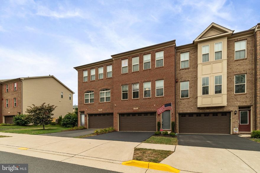 Step inside and instantly feel at home with rich hardwood flooring flowing throughout the main level—offering both timeless elegance and everyday durability. The gourmet kitchen is truly the heart of the home, designed to impress with sleek granite countertops, a stunning full-length tile backsplash, cooktop with double ovens, and a French door refrigerator. A spacious walk-in pantry keeps everything perfectly organized for effortless living.

The light-filled, open-concept main level is perfect for both entertaining and relaxing, seamlessly extending to a 20x12 composite deck—ideal for morning coffee or evening gatherings—overlooking a beautifully crafted stamped concrete patio below.

Upstairs, retreat to the luxurious owner’s suite featuring a tray ceiling, generous walk-in closet, and a spa-inspired bathroom complete with a custom grout-less stone shower, rain head, and handheld wand—your own private oasis.

The fully finished walk-out basement adds even more living space with a large rec room, stylish LVP flooring, and a convenient half bath—perfect for guests, game nights, or a home office.

Perfectly positioned near major commuter routes, shopping, dining, and top-rated schools, this home offers the ideal blend of luxury, comfort, and convenience. Truly move-in ready—this is the one you’ve been waiting for.