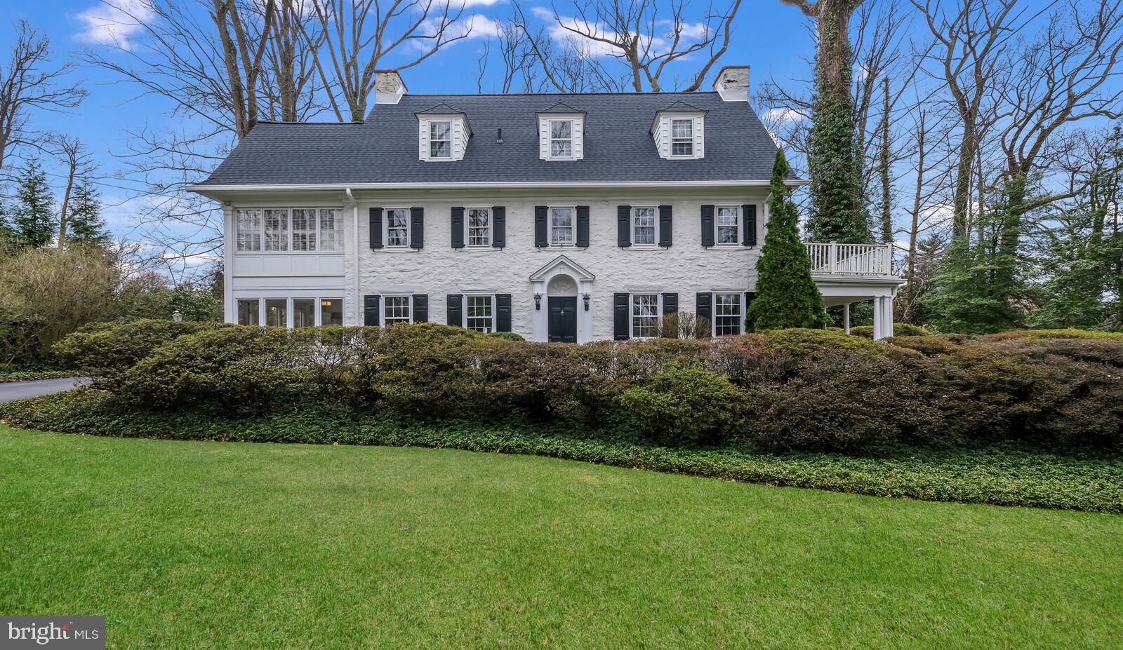Stately Turn of the Century Colonial on 1 acre lot. This Center Hall Colonial home features the charm of yesteryear but with modern updates that will not disappoint. On the main level there is a living room with fireplace, wood floors, accent lighting and french doors to a covered porch and wrap around deck. A perfect place for outside entertaining. The formal dining room boasts, accent moldings, wood floors and opens to a bright and cheery den, breakfast sun room with wet bar and family room. This area features a full wall of windows, vaulted ceiling, sky lights, gas fireplace and french doors. The kitchen, centrally located on the main level has been updated with quartz counters, island with gas cook top, accent lighting and stainless appliances. Off the center hall foyer there is a stately stair case with large landings. The second floor has master bedroom with adjacent bath, bright sitting room, ideal for an office or sitting room. There is also a full bath and 3 additional bedrooms completing this level. The 3rd level has 3 additional bedrooms, updated bath and attic storage. This space is ideal for in-law suite, Au pair or guest room. The lower level is finished with powder room, laundry and outside exit. This is great space for the family to game, craft or entertain during gatherings or that rainy day. Don't miss the opportunity to make this address your home and enjoy the close proximate of public transportation, universities, shops and restaurants and everything that makes the Main Line a great place to live! Note, the fires showing in the fireplace pictures are virtual .