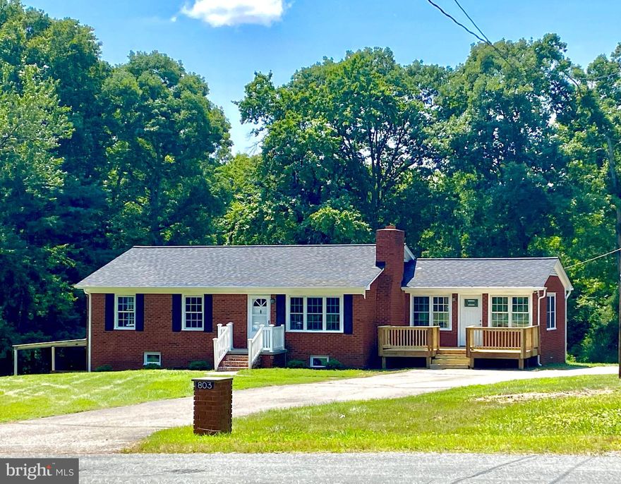 Enjoy country living close to everything you need on this over 1/2 acre of green grass and tree lined back yard! Seasonal colors will blow you away! 4 bedrooms and 2 baths with beautiful updated features all around. Living room w/fireplace opens to remodeled kitchen with beautiful quartz countertops and expanded family rm/dining room that opens to brand new deck. Lower level has a nice rec room walk out level w/ covered patio. Bedroom, full bath and laundry/storage area. NEW ROOF, NEW HVAC.  NEW GUTTERS.  NEW FLOORING.  NEW PATIO. NEW DOORS.  And LOTS more!!!! Close to Lake Anna, Great restaurants and more!