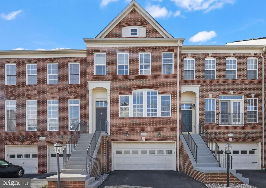 Welcome to 22047 Avonworth Sq, a beautifully maintained brick front townhome in the sought-after Broadlands community, offering the perfect blend of comfort, style, and everyday convenience. From the moment you step inside, you’re greeted by an open concept layout filled with abundant natural light, gleaming hardwood floors, and recessed lighting that create a warm and inviting atmosphere. The main level flows effortlessly between the living room, dining room, and breakfast space, complemented by a well-placed powder room. At the heart of the home, the expansive kitchen is designed for both entertaining and daily living, featuring granite countertops, stainless steel appliances, a gas cooktop, an eat-in island, and an abundance of cabinet space, with direct access to the deck for seamless indoor-outdoor living.

Upstairs, the spacious primary suite offers plush carpeting, generous proportions, and a luxurious en suite bath complete with dual sinks, a soaking tub, and a separate shower—your own private retreat. Two additional well-appointed bedrooms, a full bath, and a convenient laundry room complete the upper level. The lower level adds incredible flexibility with a cozy fireplace, a full bathroom, and versatile living space ideal for a recreation room, guest suite, or home office.

Outside, enjoy a deck and fully fenced rear yard, perfect for relaxing or entertaining, along with the convenience of a two-car garage and driveway parking. Residents of Broadlands enjoy an impressive array of amenities including tot lots, a clubhouse, pool, tennis courts, trails, basketball courts, and community activities for all. Ideally situated in a prime commuter location close to shopping, dining, and major routes, this home offers the lifestyle, location, and livability today’s buyers are searching for.